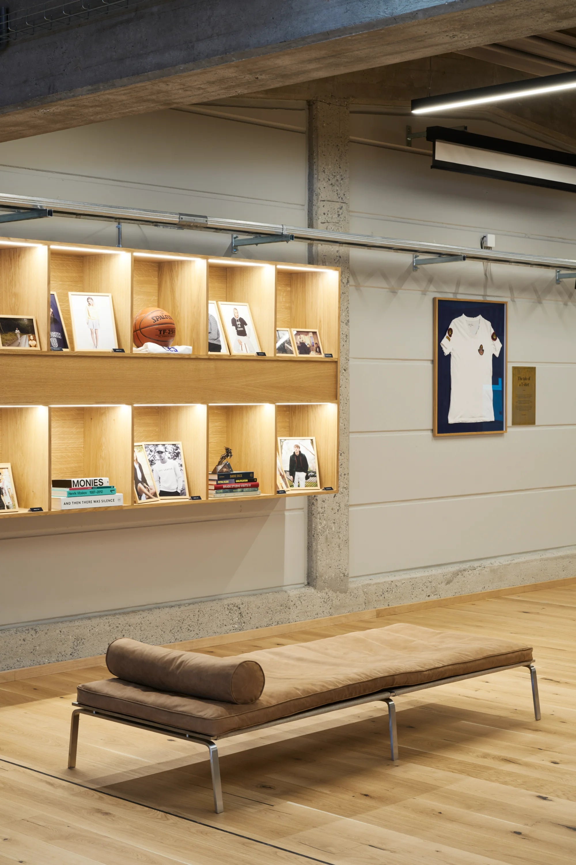 Modern interior with a wooden bench and bookshelf in a casual setting.