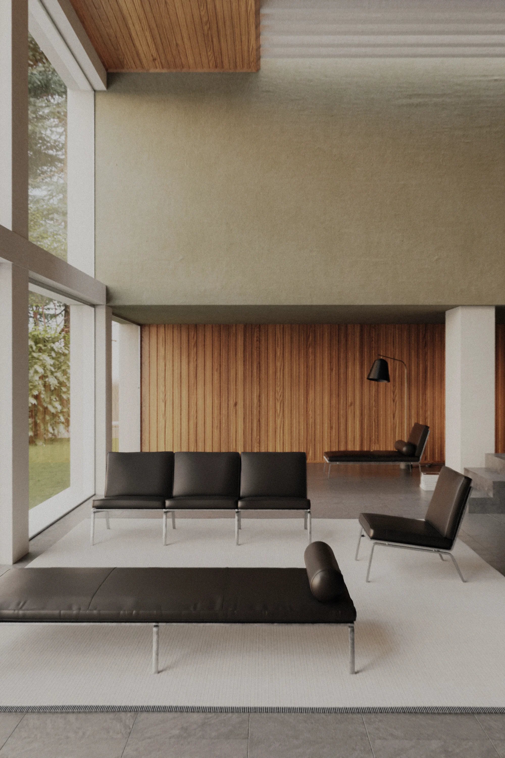 Modern interior with black leather furniture and wooden walls.