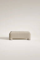 Beige ottoman on a light beige background