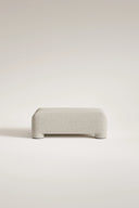 Gray ottoman on a light beige background