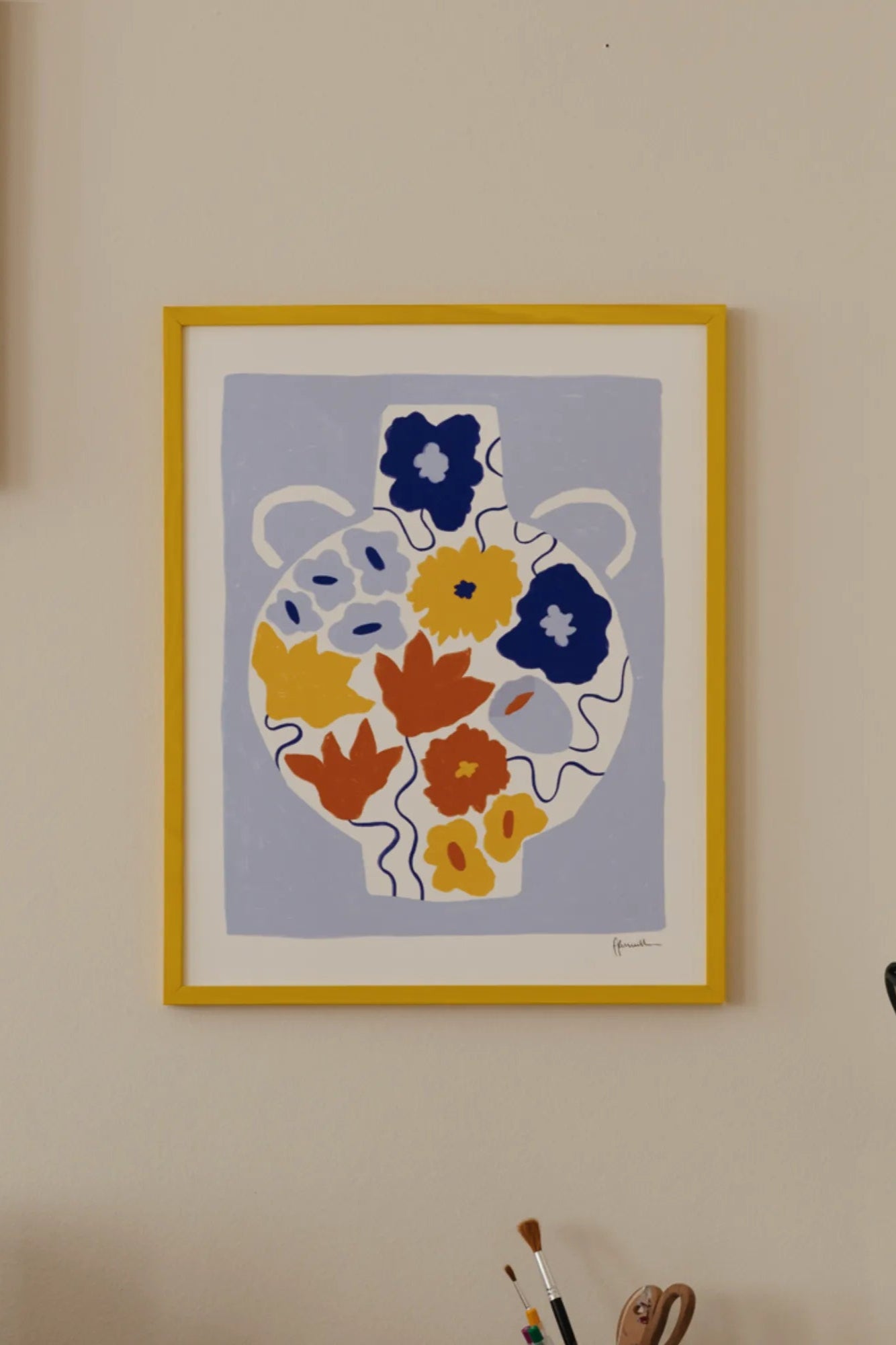 Beautiful ceramic flower pot with a blue floral design and a drainage hole