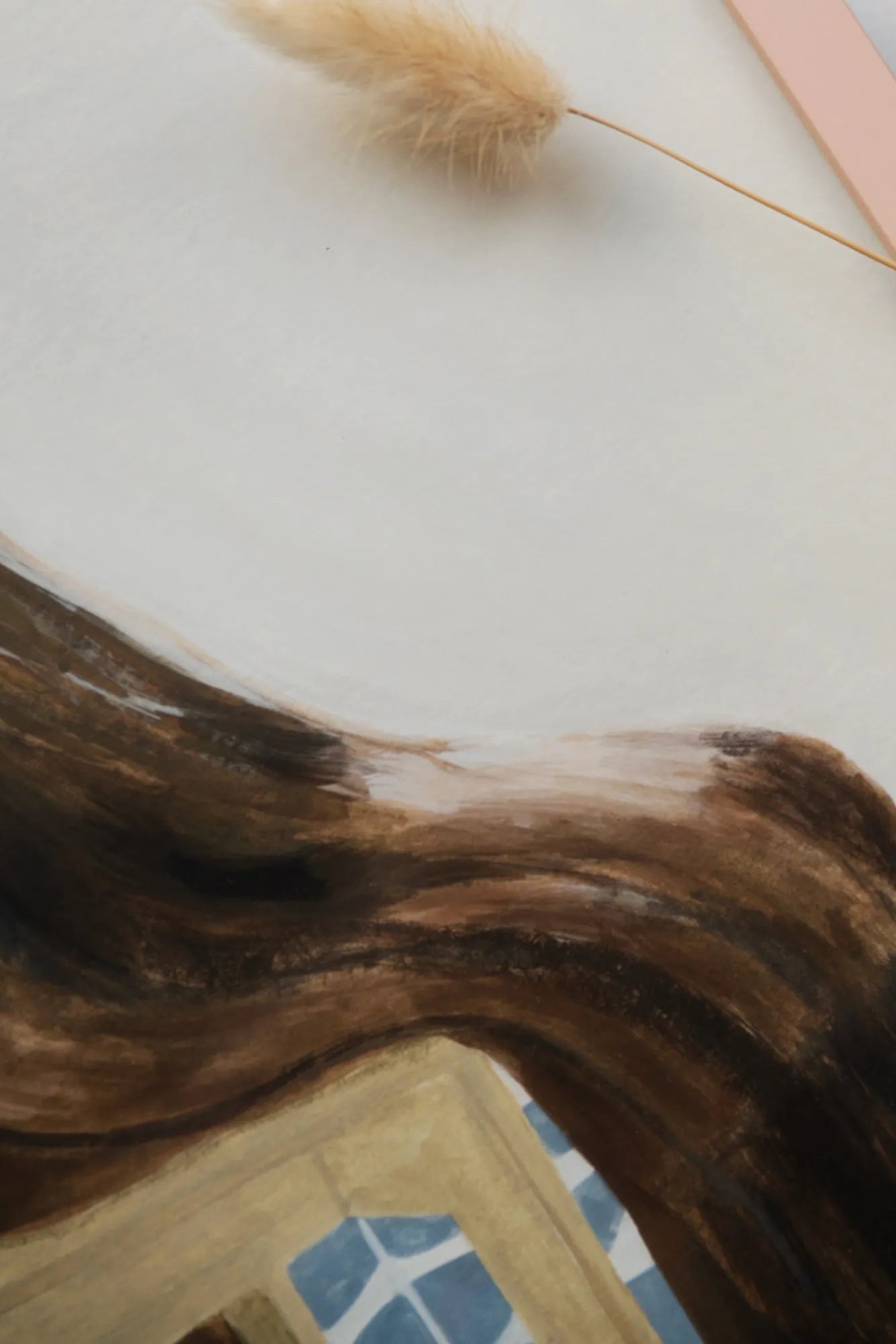 Cozy chair with a soft, luxurious blanket draped over the armrest