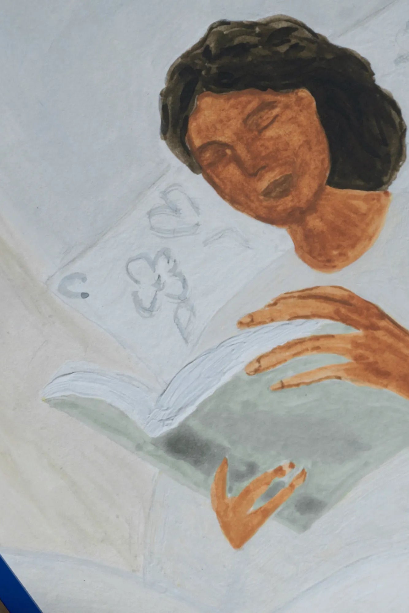 Close-up of Morning Read product with a stack of books and a pair of reading glasses on a wooden table