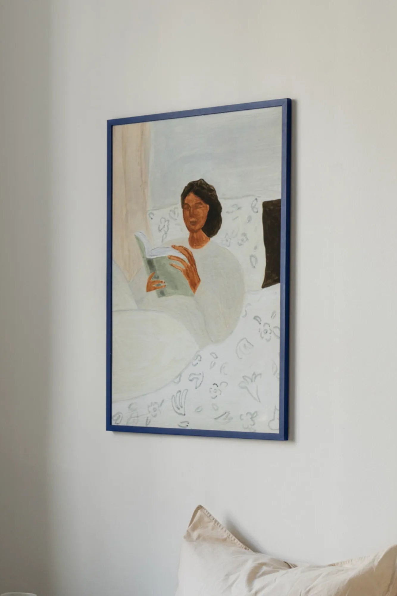 Woman enjoying the Morning Read product while sitting on a window seat