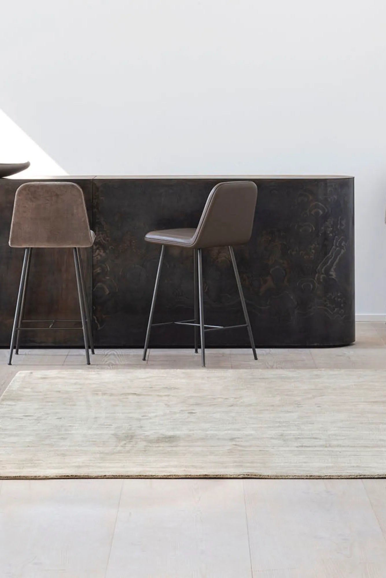 Hand-woven ivory Karma Rug with intricate geometric patterns and tassels