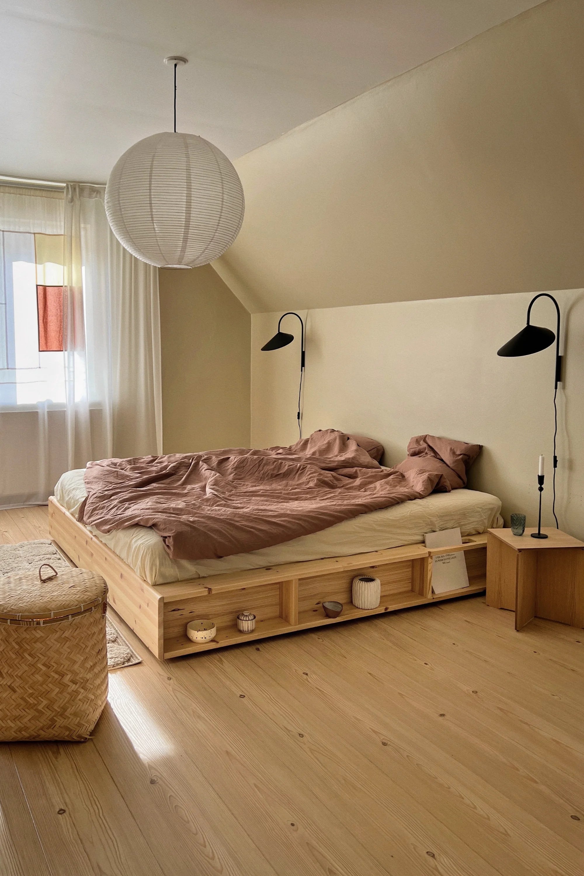 Modern bedroom with wooden bed and minimal decor