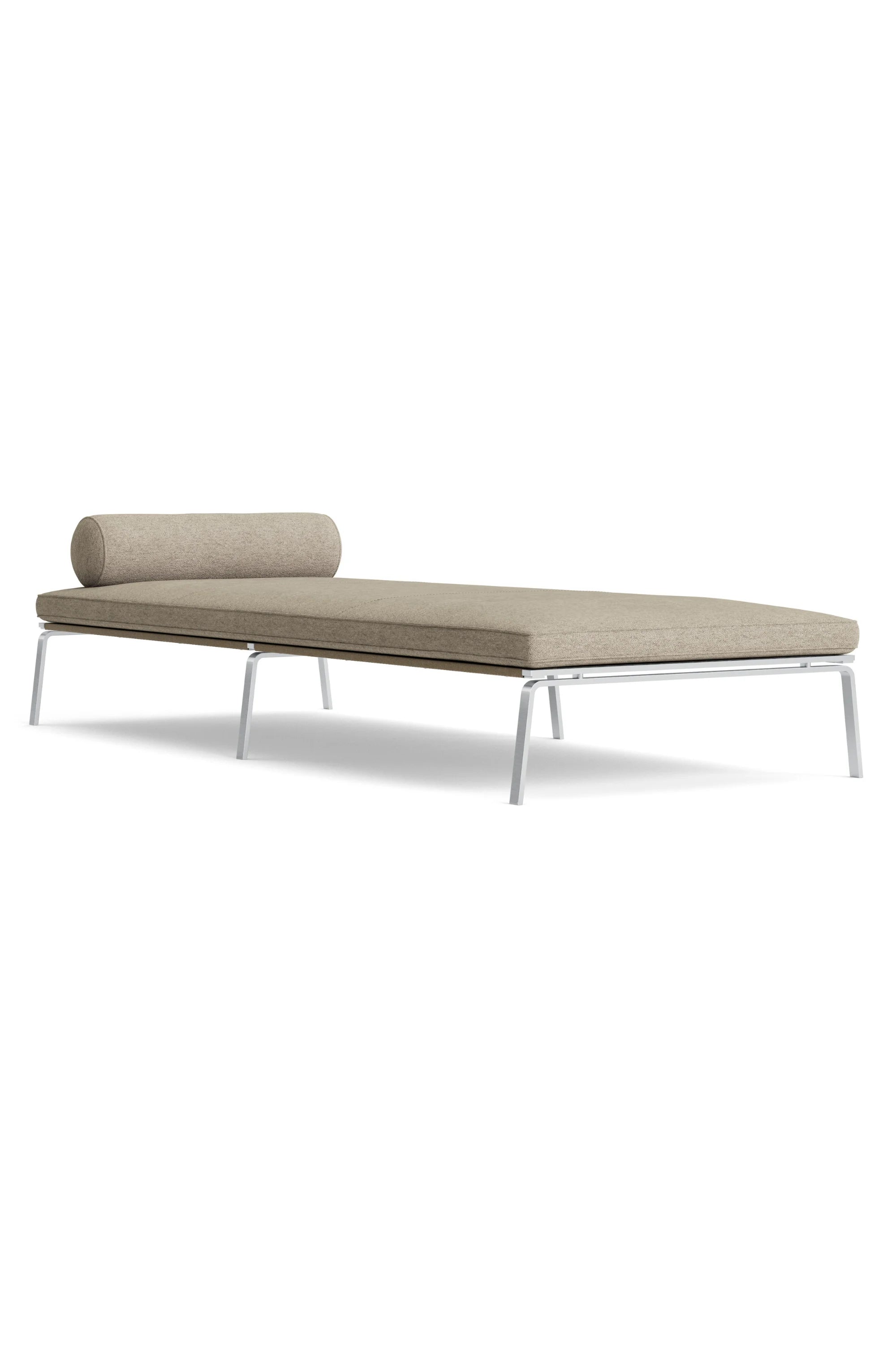 Modern daybed with beige cushion on a white background