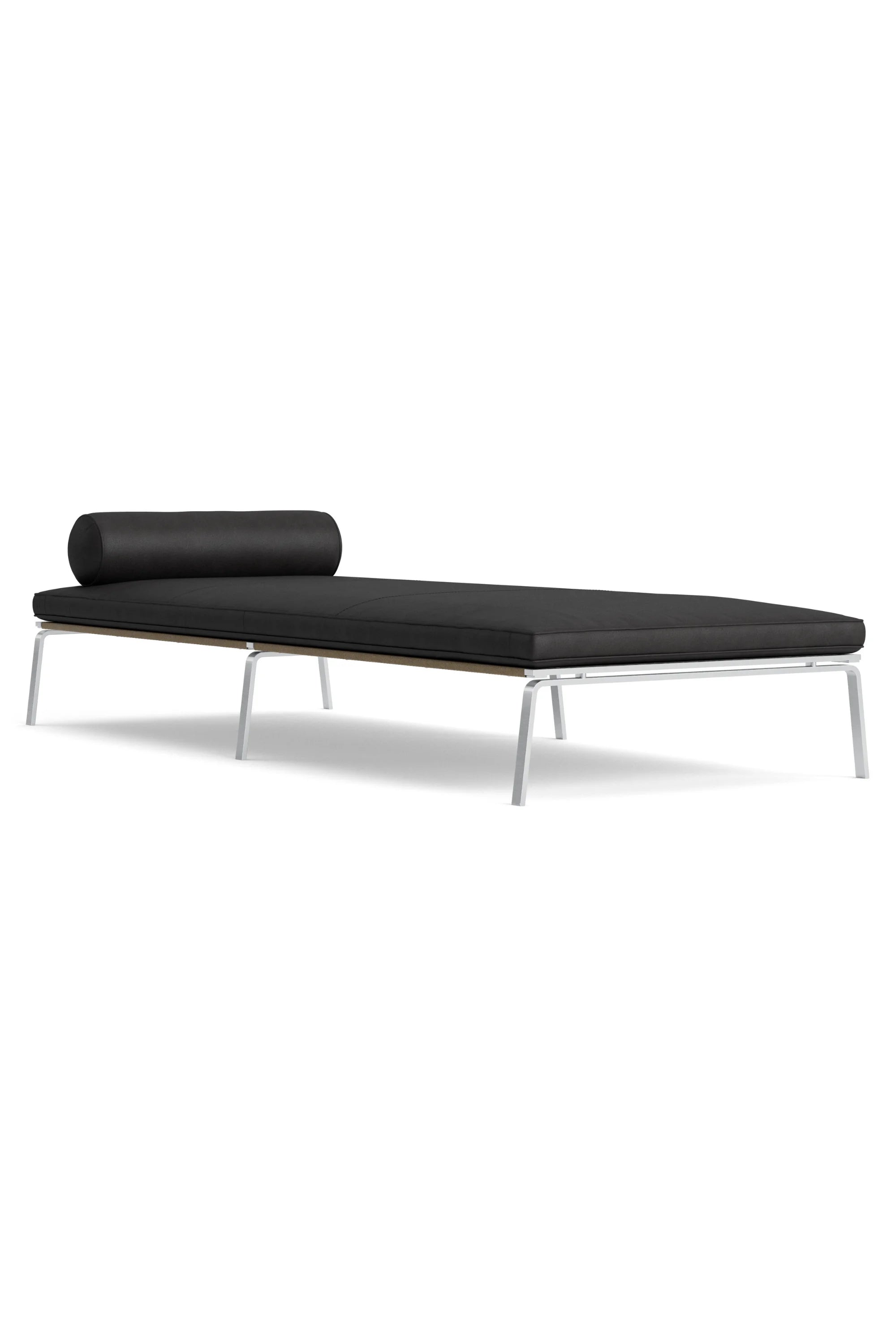 Black daybed with white legs on a white background
