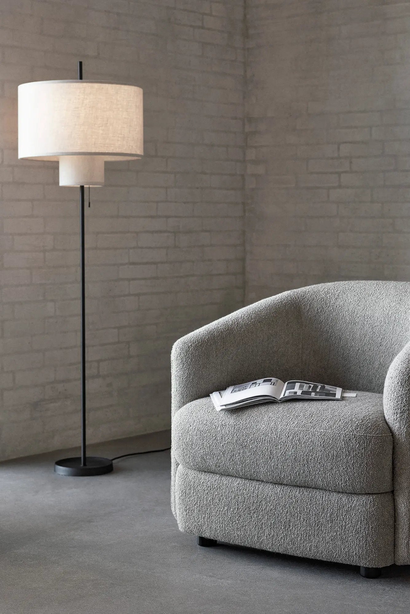 Tall standing floor lamp with adjustable arm for versatile lighting