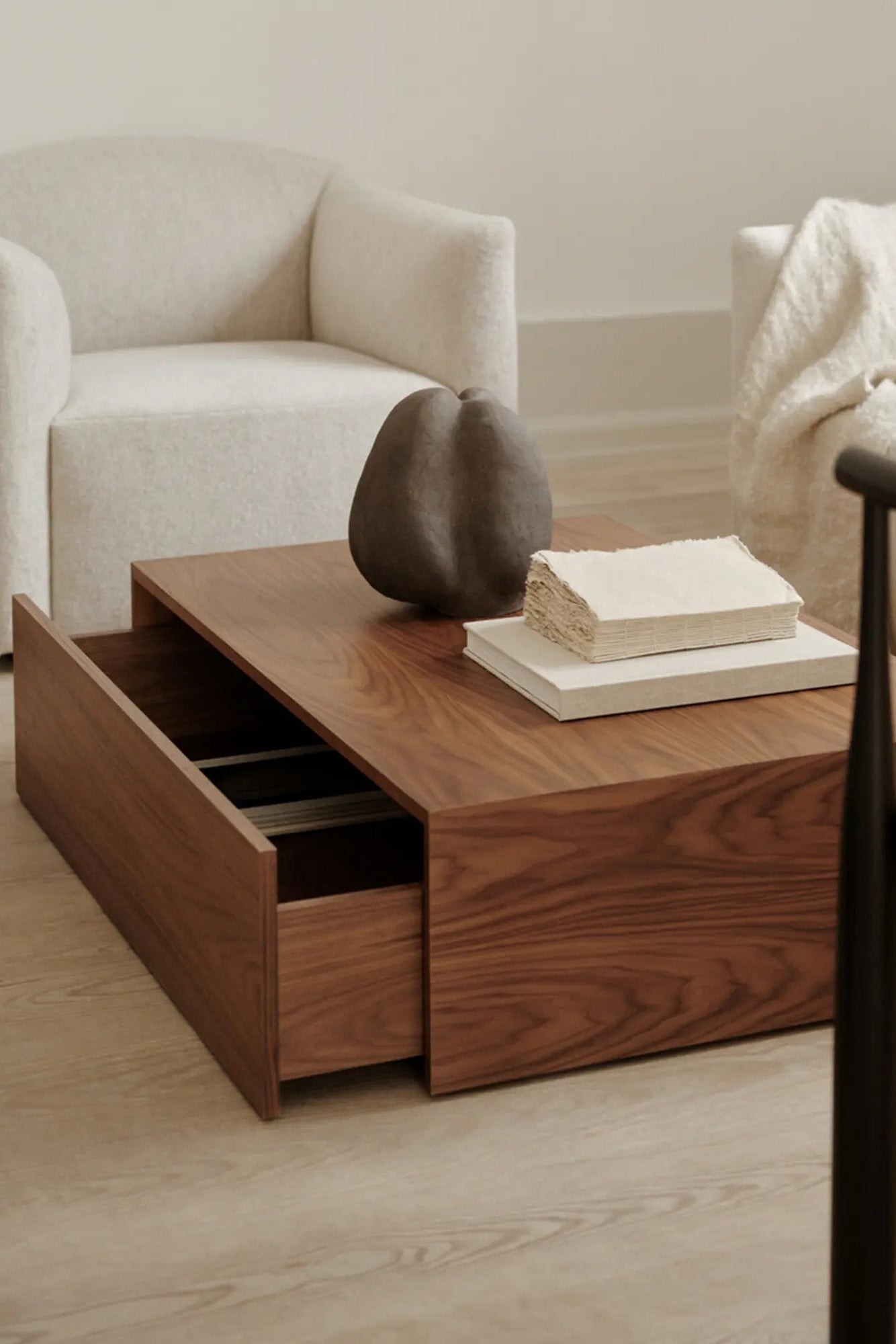 Rectangular coffee table with a sleek design and a high drawer