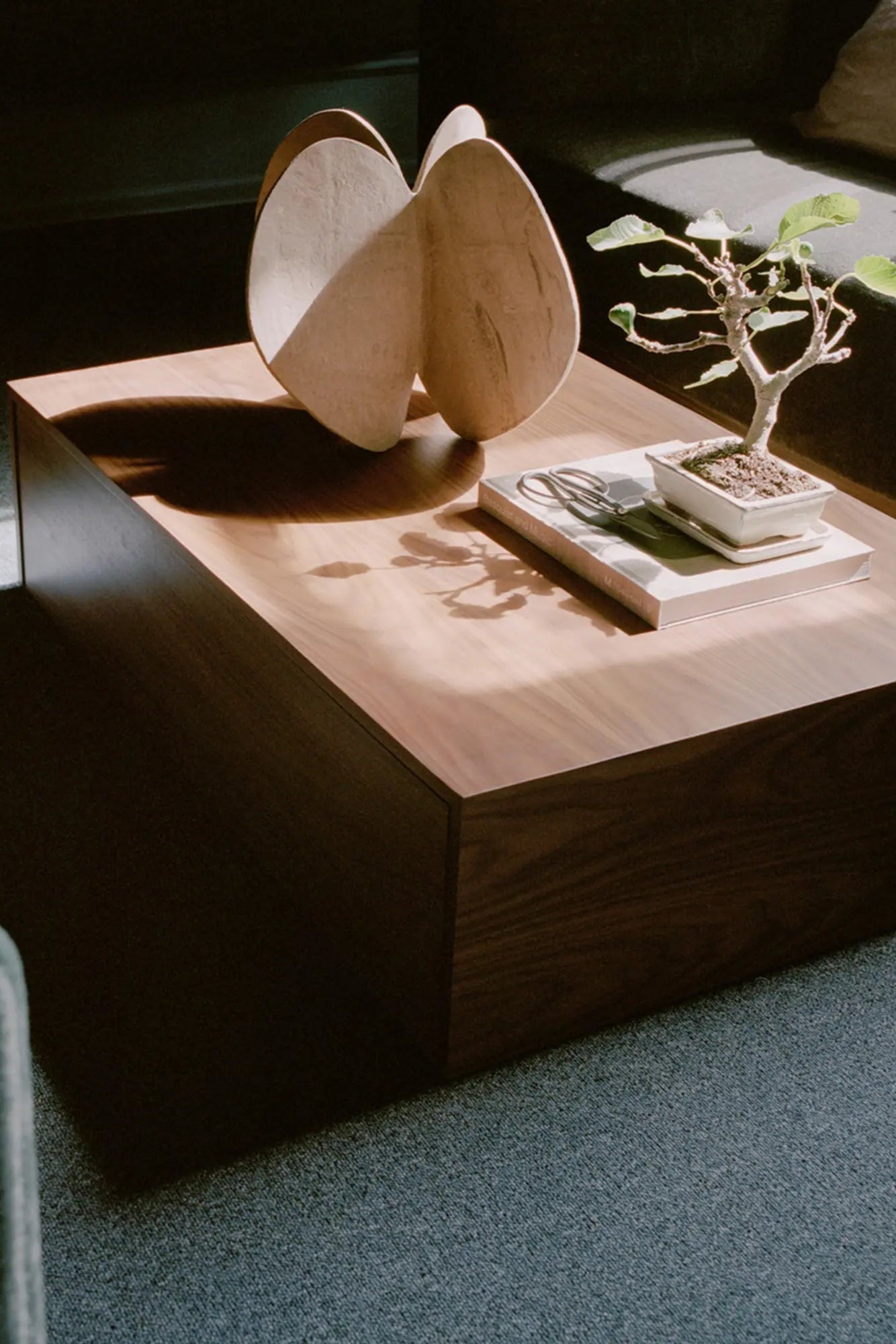 Close up of Mass Coffee Table's sturdy metal legs and clean lines