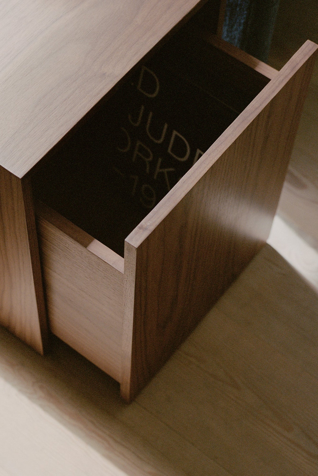 Minimalist nightstand with clean lines and a compact design for small spaces