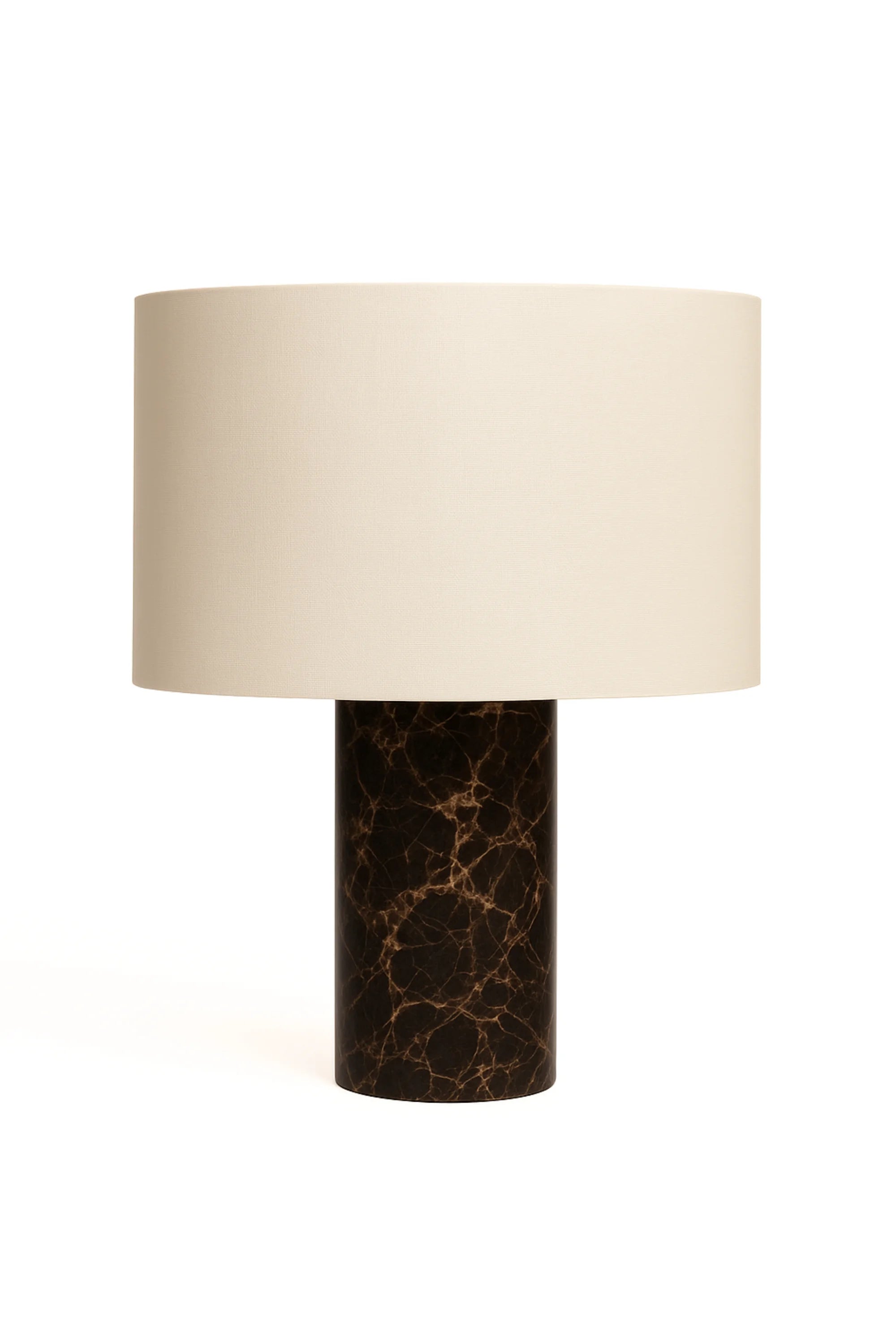 Table lamp with a marble base and beige shade on a white background