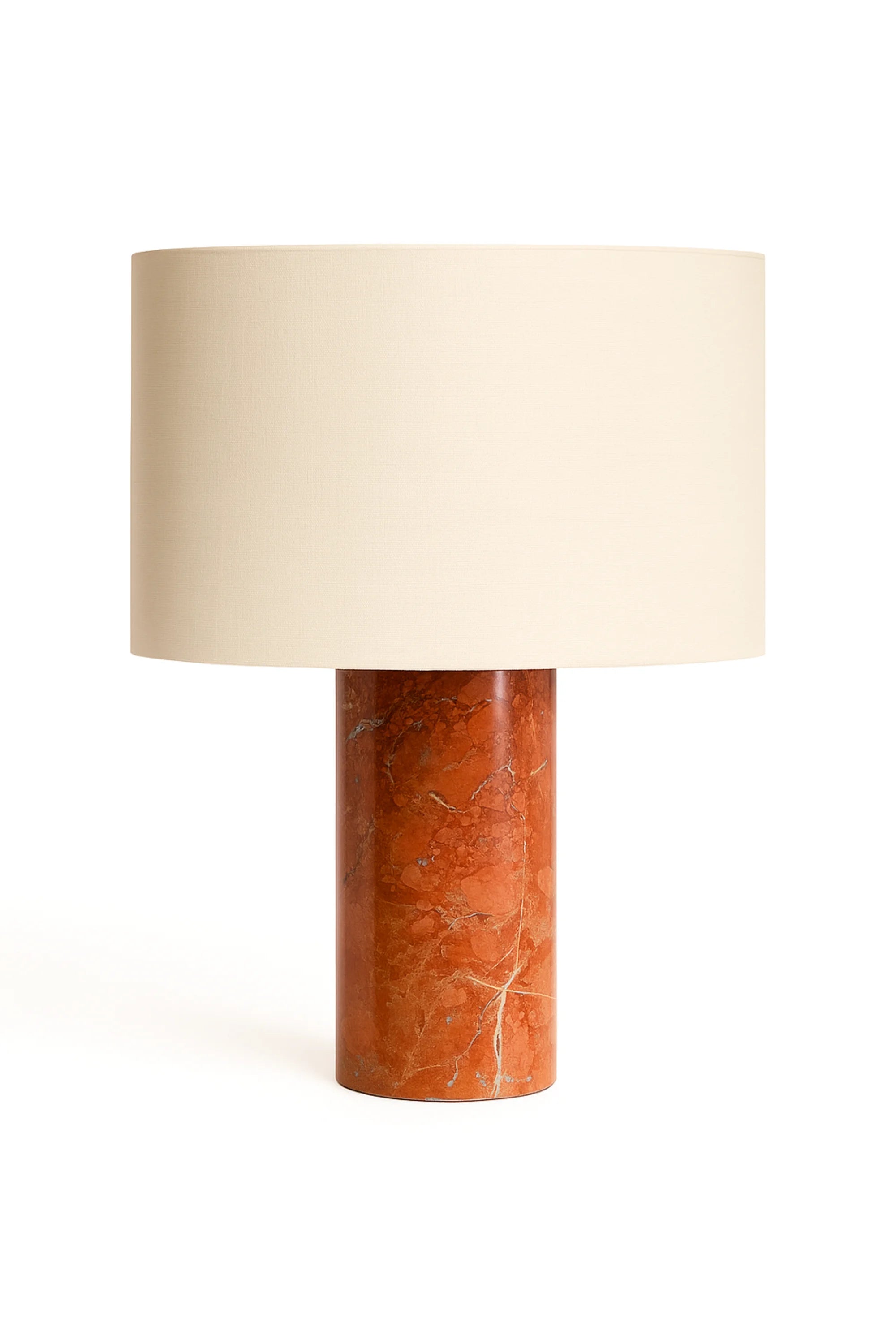Table lamp with a brown marble base and beige lampshade on a white background