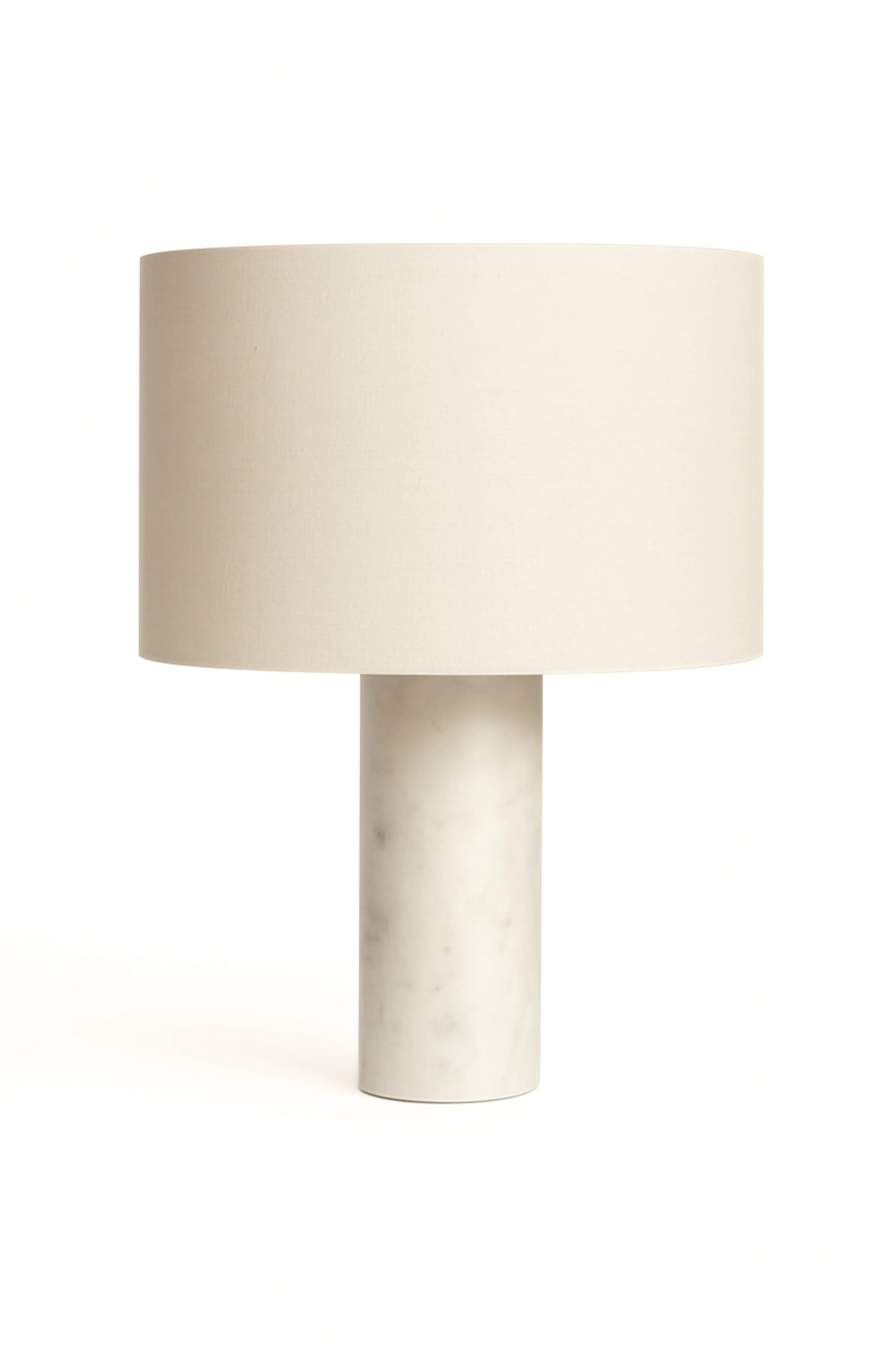 Table lamp with a beige shade and marble base on a white background