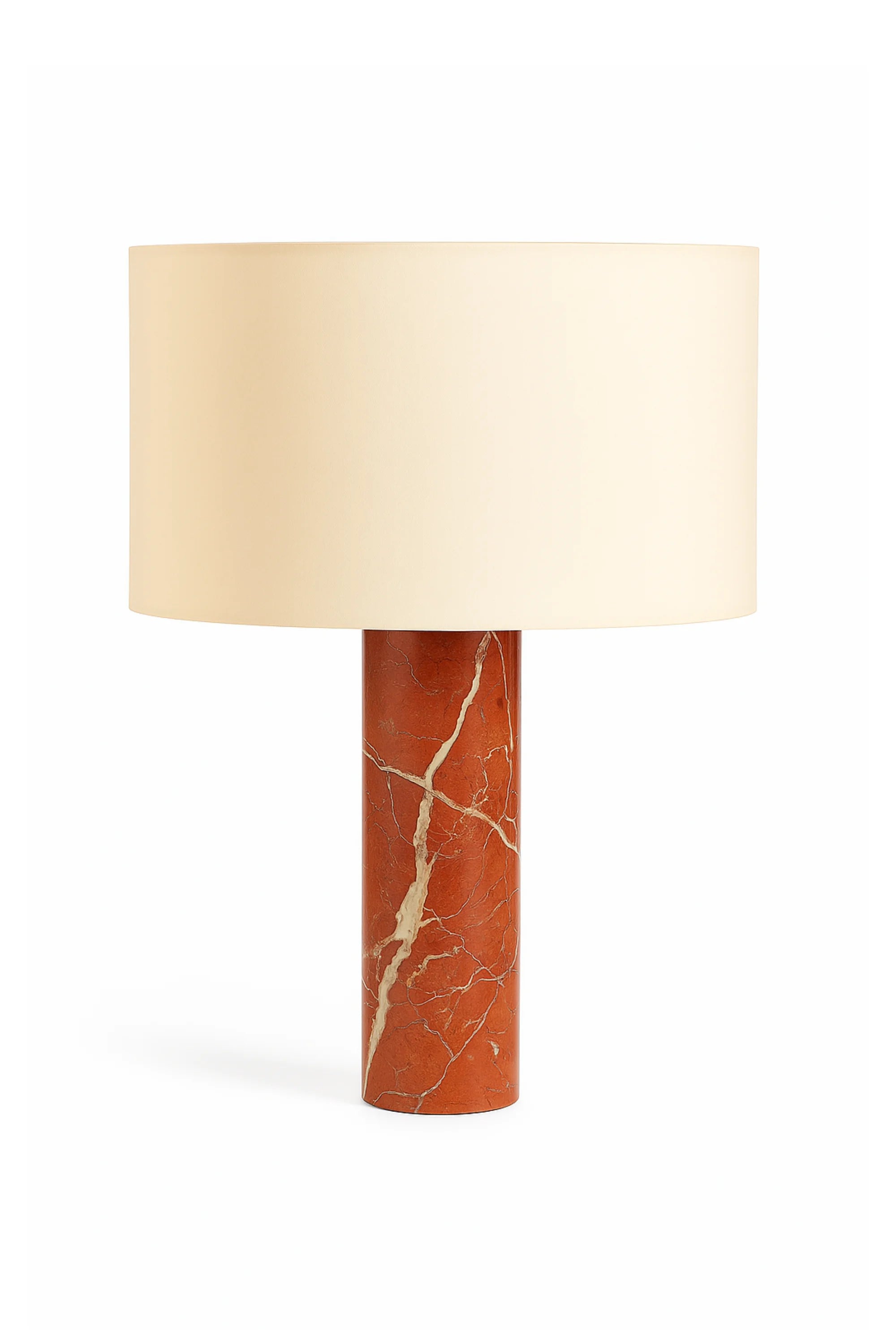 Table lamp with a cylindrical terracotta base and beige lampshade on a white background