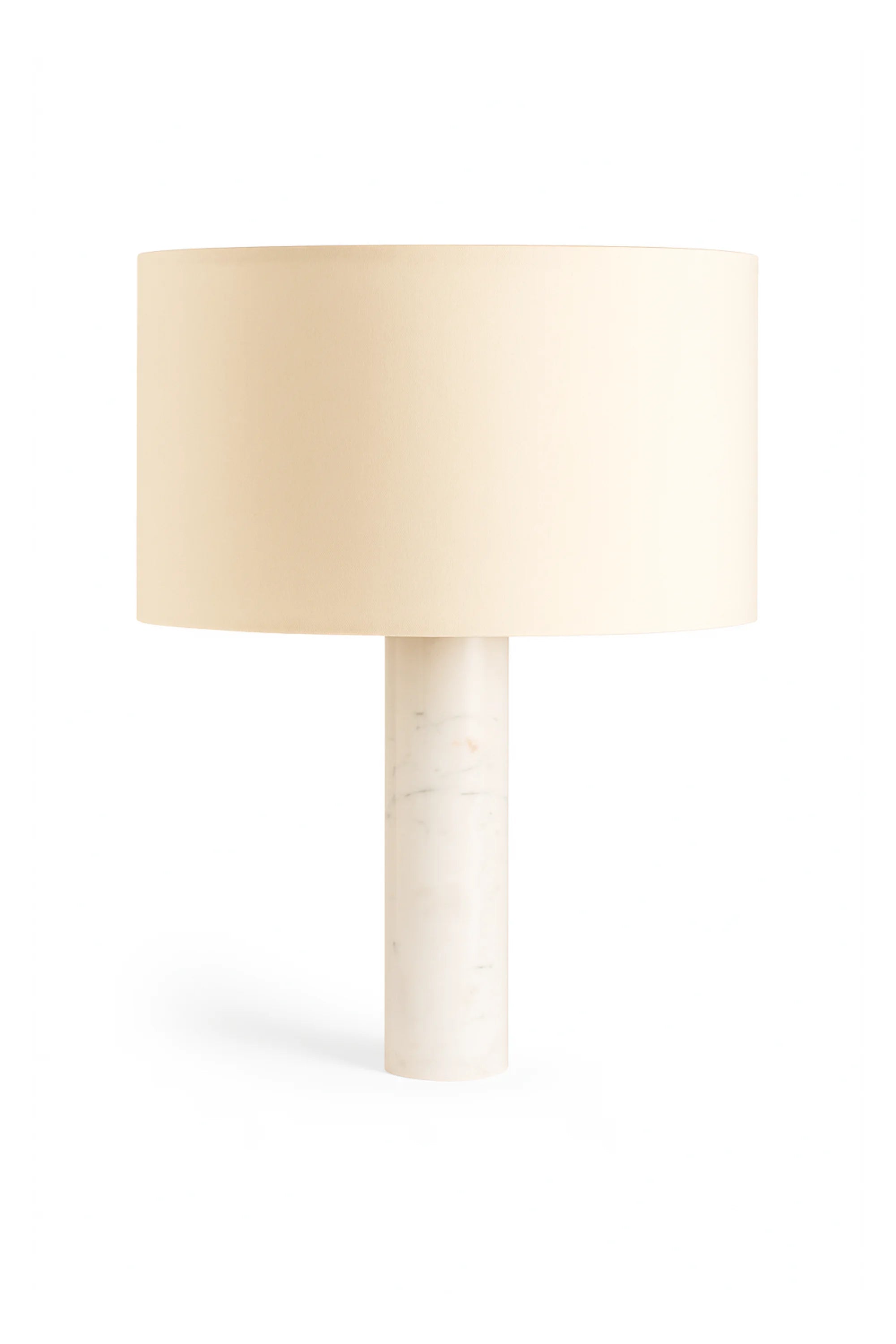 Table lamp with a beige shade and white base on a white background