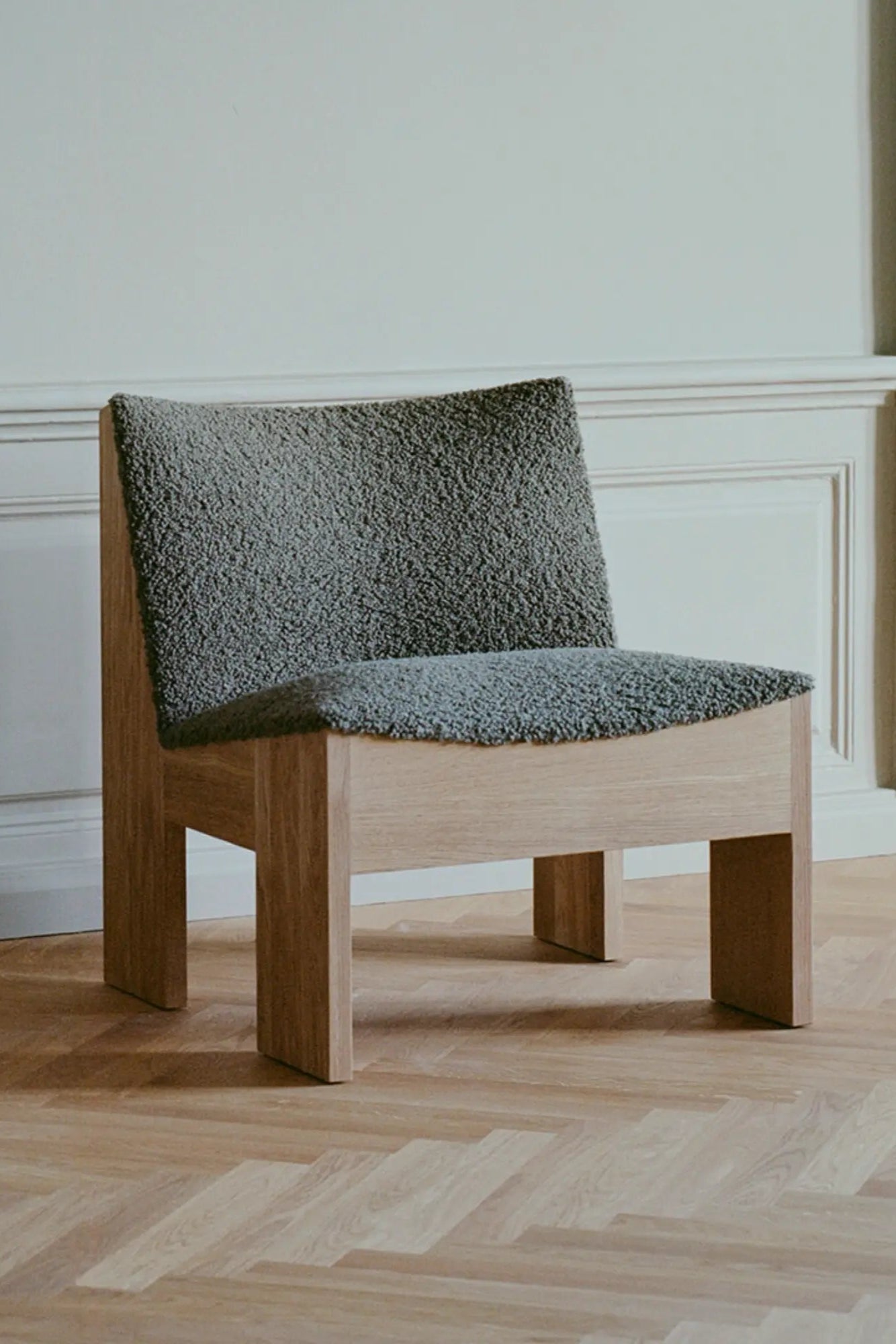 Close-up of comfortable cushioned seat on Tenon Armchair