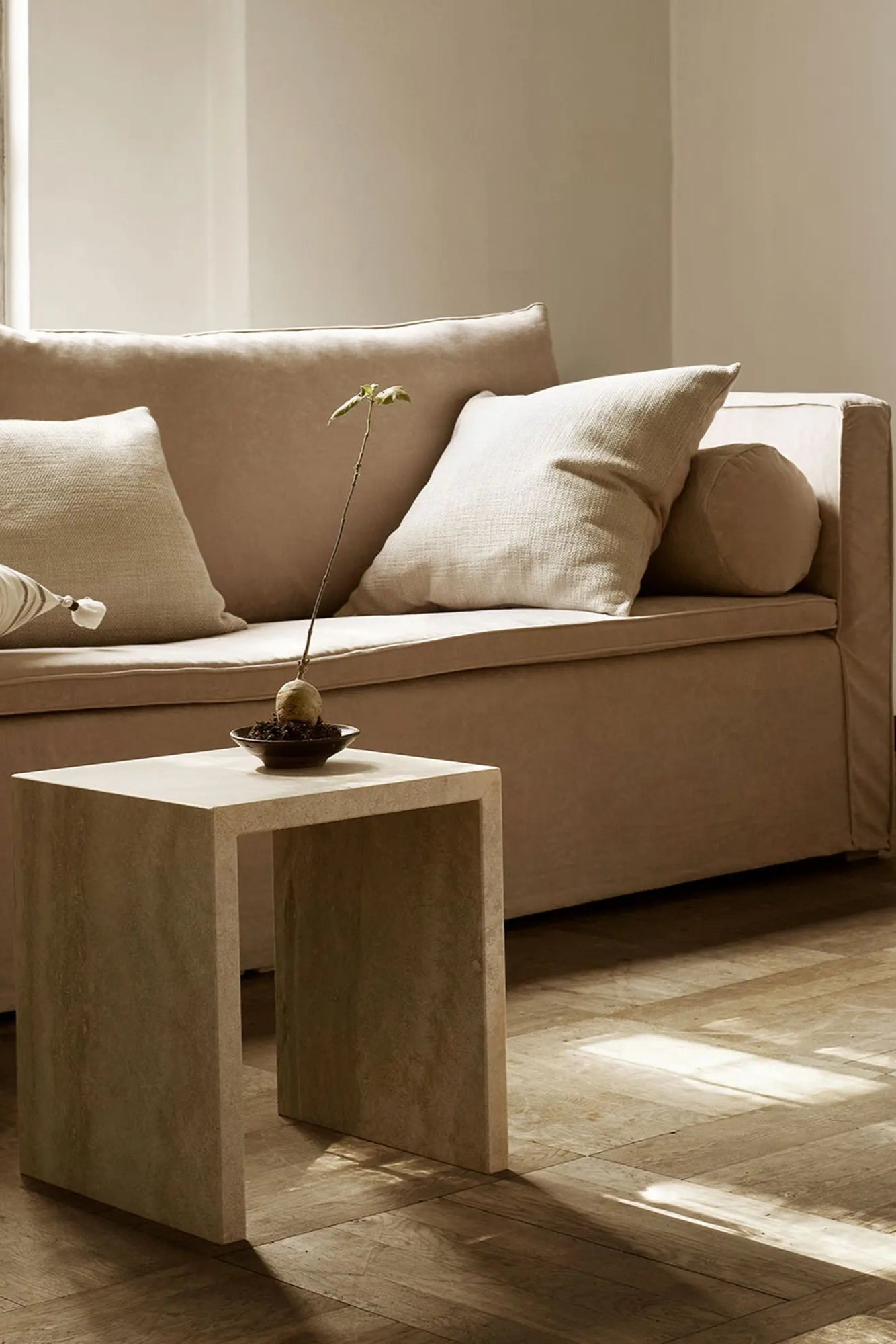 Modern and stylish travertine table with cube-shaped base