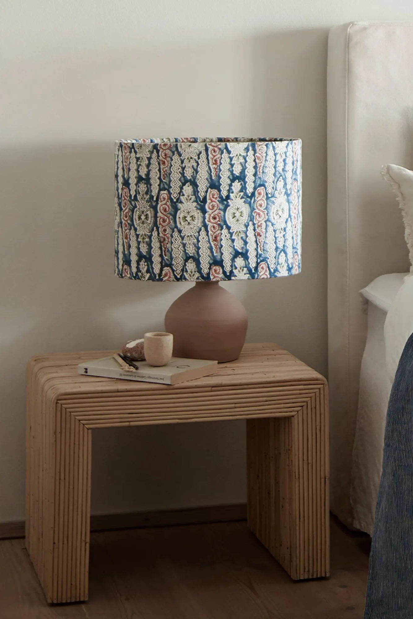 Hand-woven rattan side table with intricate geometric design and sturdy construction