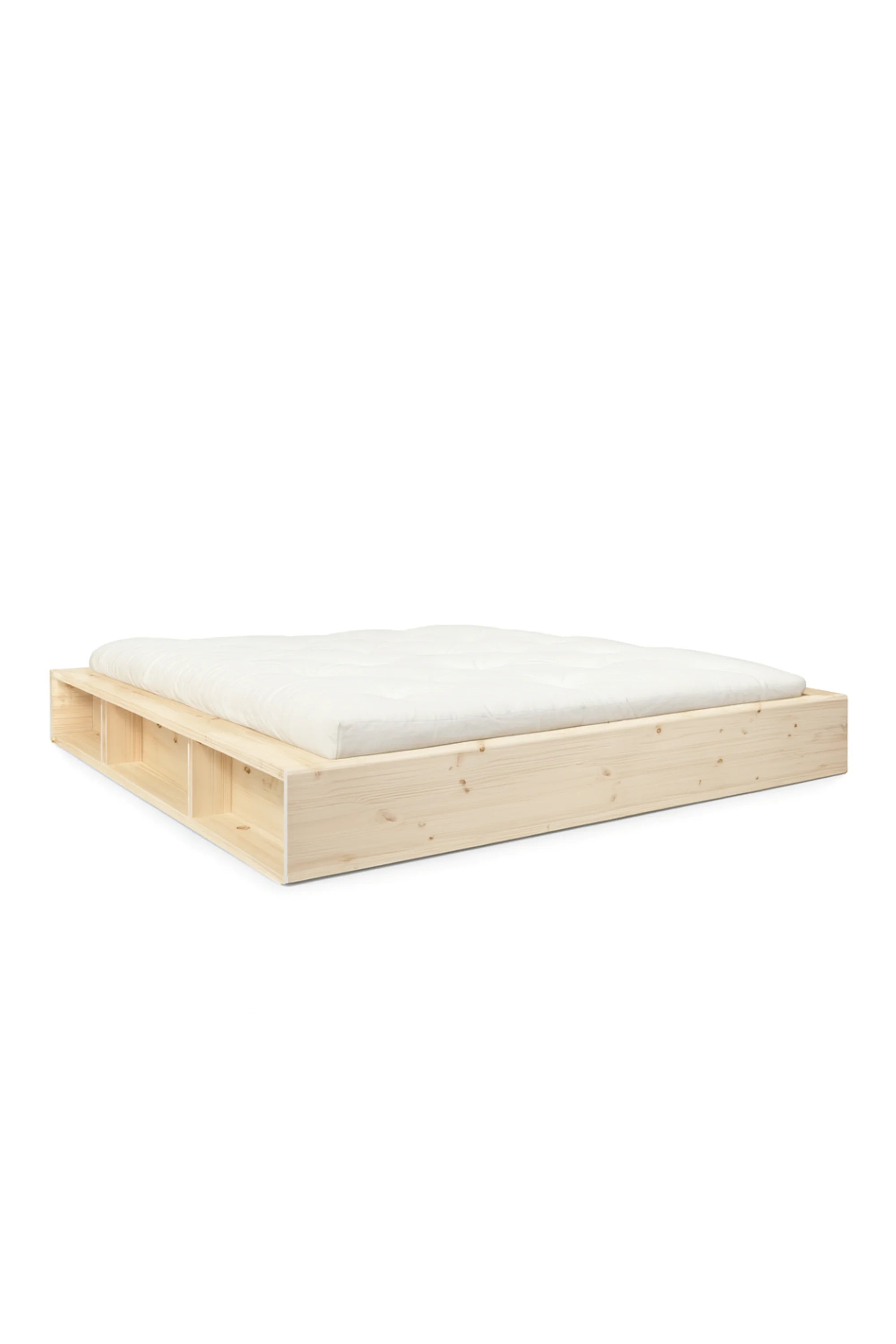Wooden bed frame with white mattress on a white background