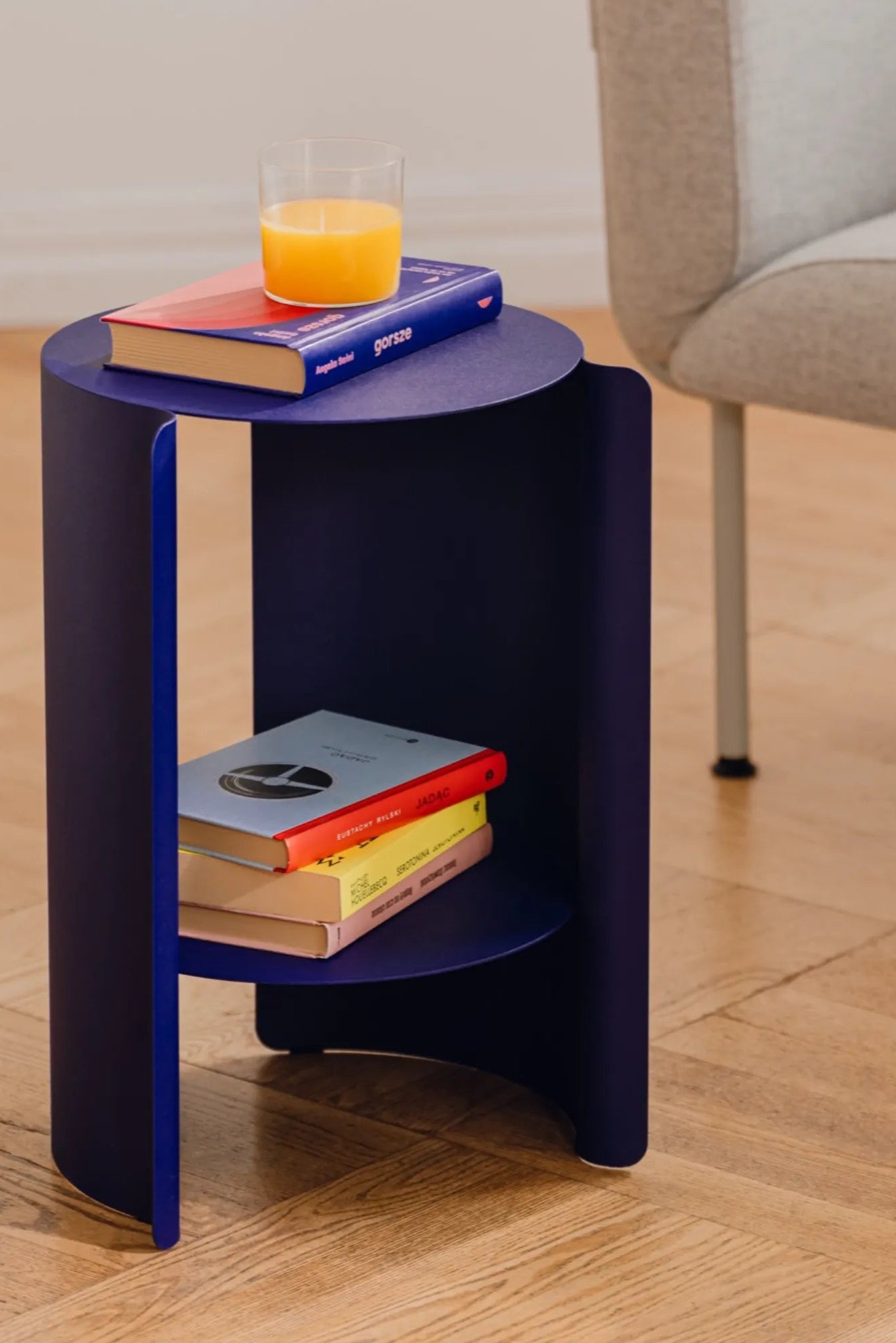 A modern, sleek, and minimalist wa side table with a wooden top and metal legs