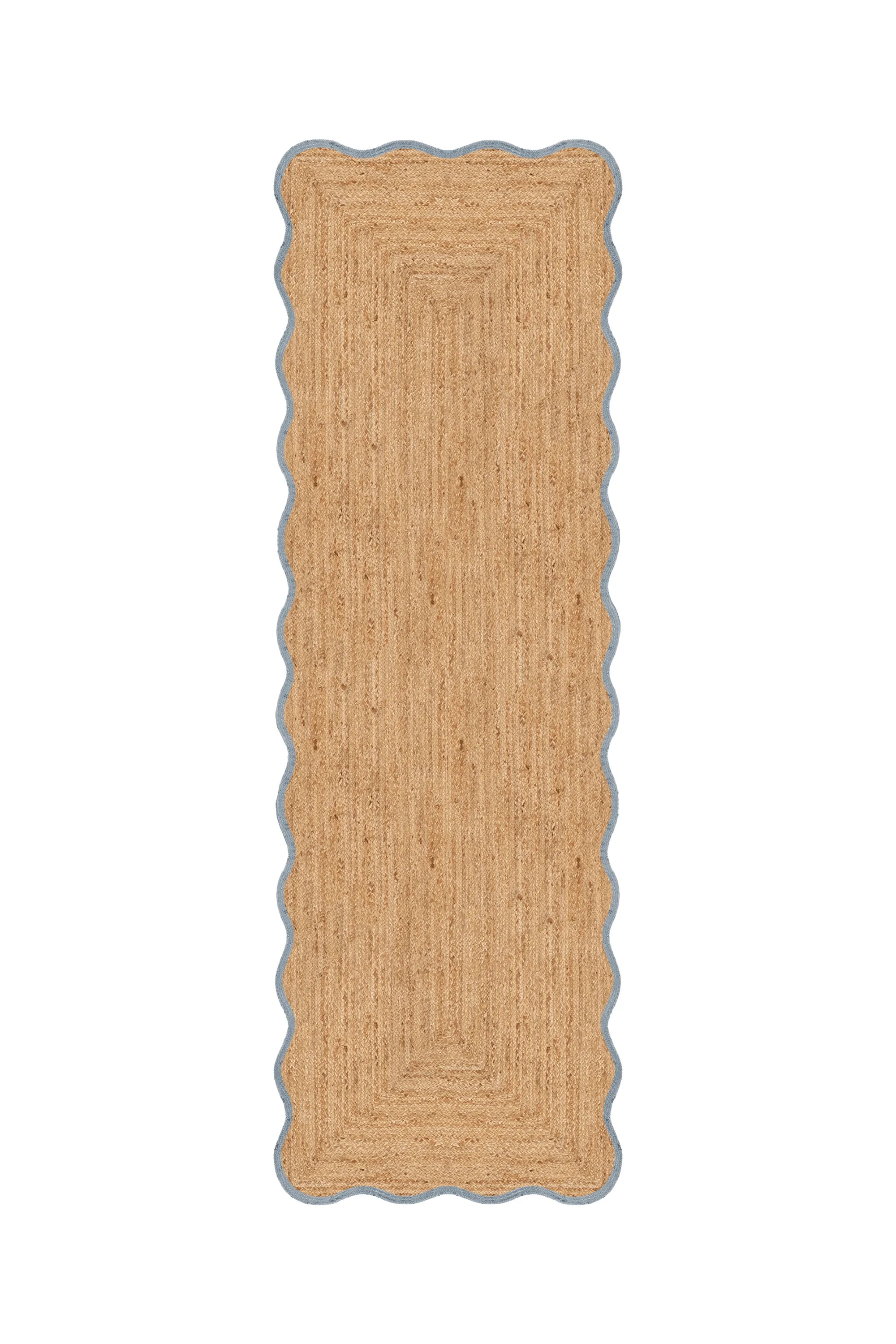 Rectangular jute rug with scalloped edge on a white background
