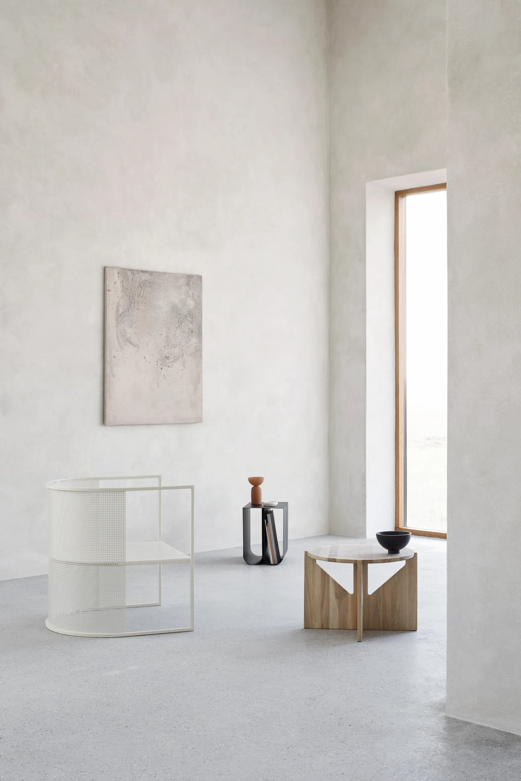 Kristina Dam Simple Coffee Table, a modern minimalist coffee table featuring a round white marble top resting on a sculptural geometric base crafted from light natural oak wood. This Scandinavian-inspired design offers a clean, organic aesthetic, making it perfect for contemporary living rooms, Japandi lounge areas, or a sophisticated bedroom accent.