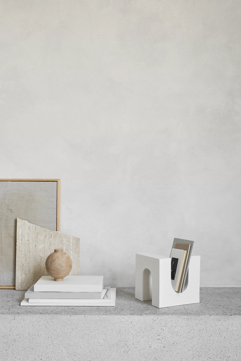 Kristina Dam Wooden Sphere, a natural light wood decorative sphere crafted from solid wood with a smooth, carved surface and visible wood grain. This modern minimalist design features a small opening at the top, making it ideal for decorative storage or as a unique small vase. Perfect for Scandinavian shelf styling or organic modern home office decor.