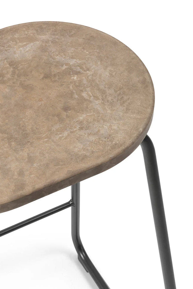 Mater Earth Counter Stool, a front packshot highlighting the unique mottled brown seat texture made from recycled materials, paired with a sleek, minimalist black metal frame, on a white background.