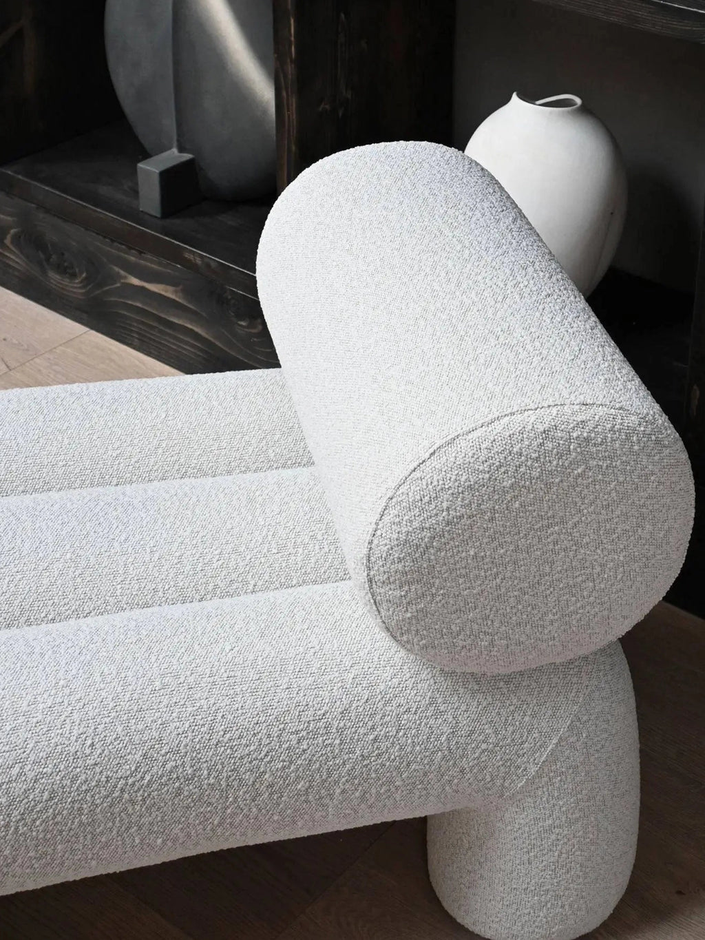 101 CPH Foku Lounge Chair in a contemporary off-white textured boucle fabric, featuring a distinctive rounded back and ribbed seat design, displayed in a stylish home setting. A luxury seating solution for modern interiors.