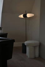 Large, sturdy, wooden stool designed in the shape of a big foot