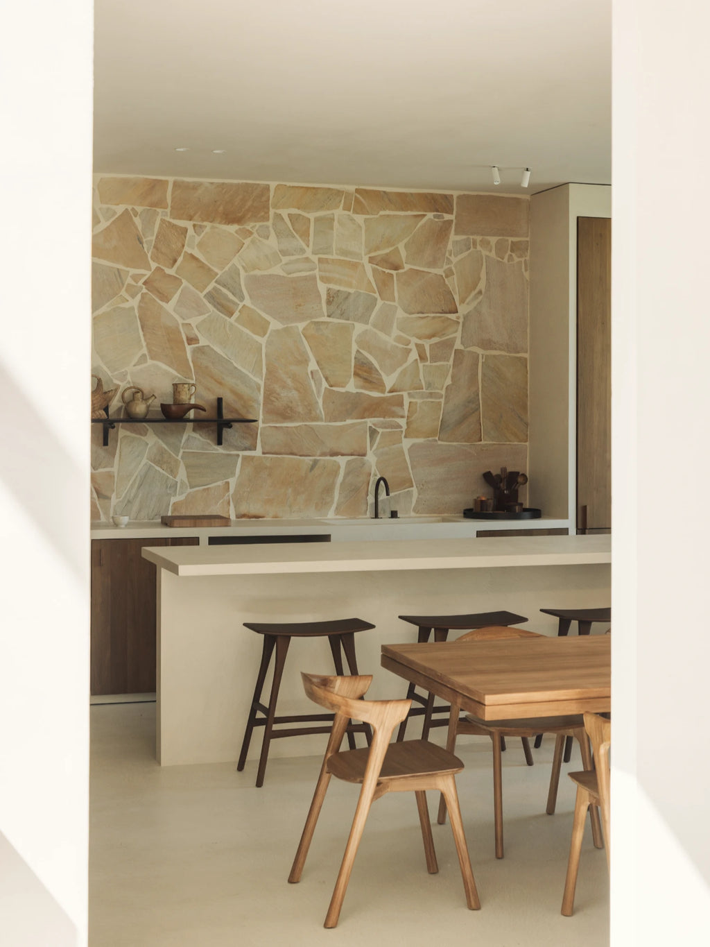 Ethnicraft PI Wall Shelf, a sleek modern minimalist floating shelf crafted from durable matte black metal with integrated PI-shaped brackets, offering a clean, contemporary silhouette. Ideal for stylish kitchen open shelving, japandi dining rooms, or organic modern living spaces to display ceramics and decor.