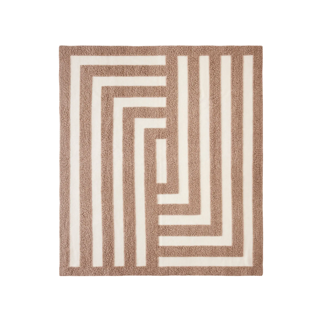 Soft and cozy Labyrinth Throw featuring intricate maze-inspired pattern in grey