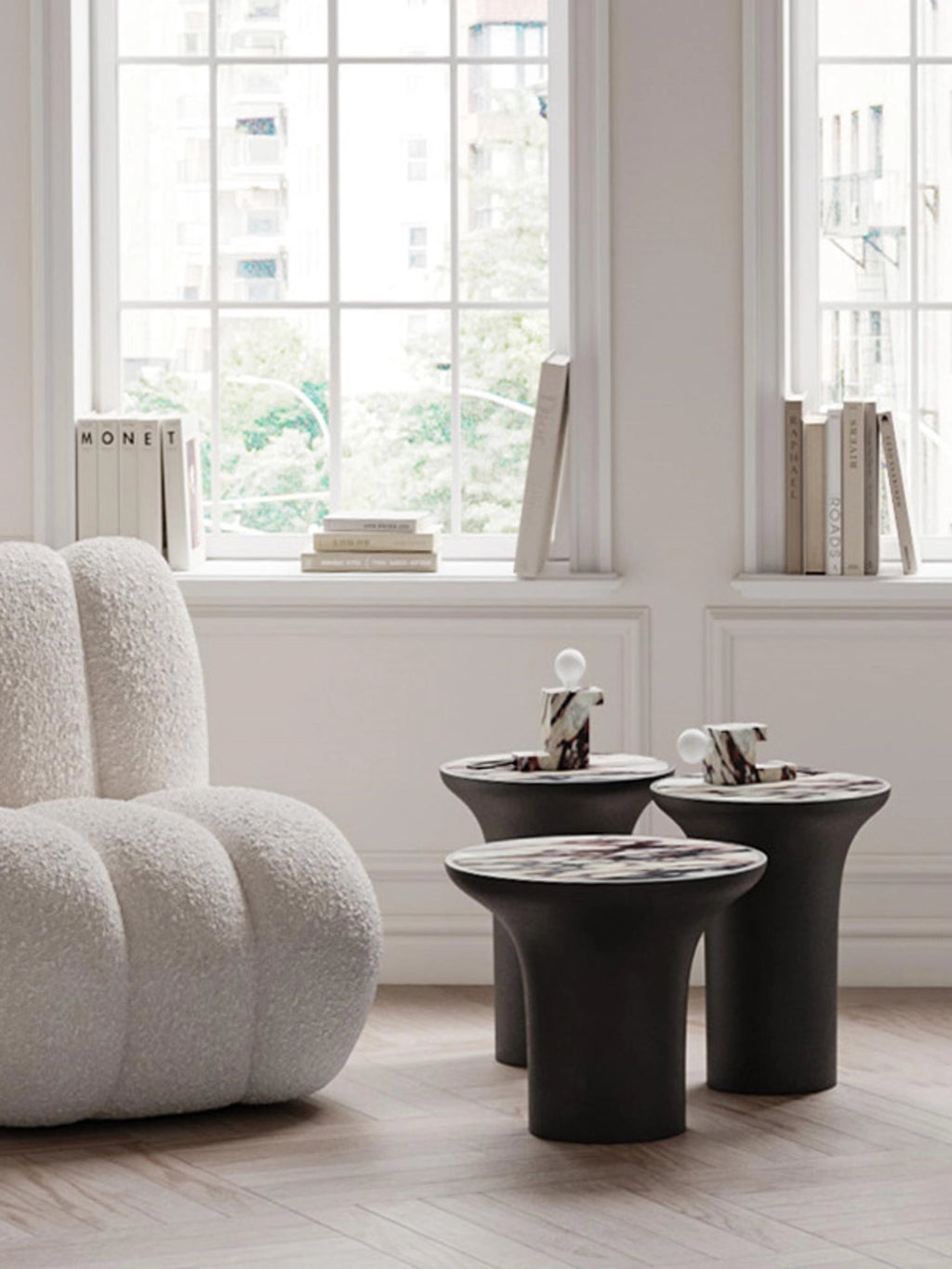 101 CPH Brick Lamp, a unique marble-patterned sculptural table lamp with a globe bulb, seen on a dark pedestal table in a stylish living room. Ideal for ambient luxury lighting.