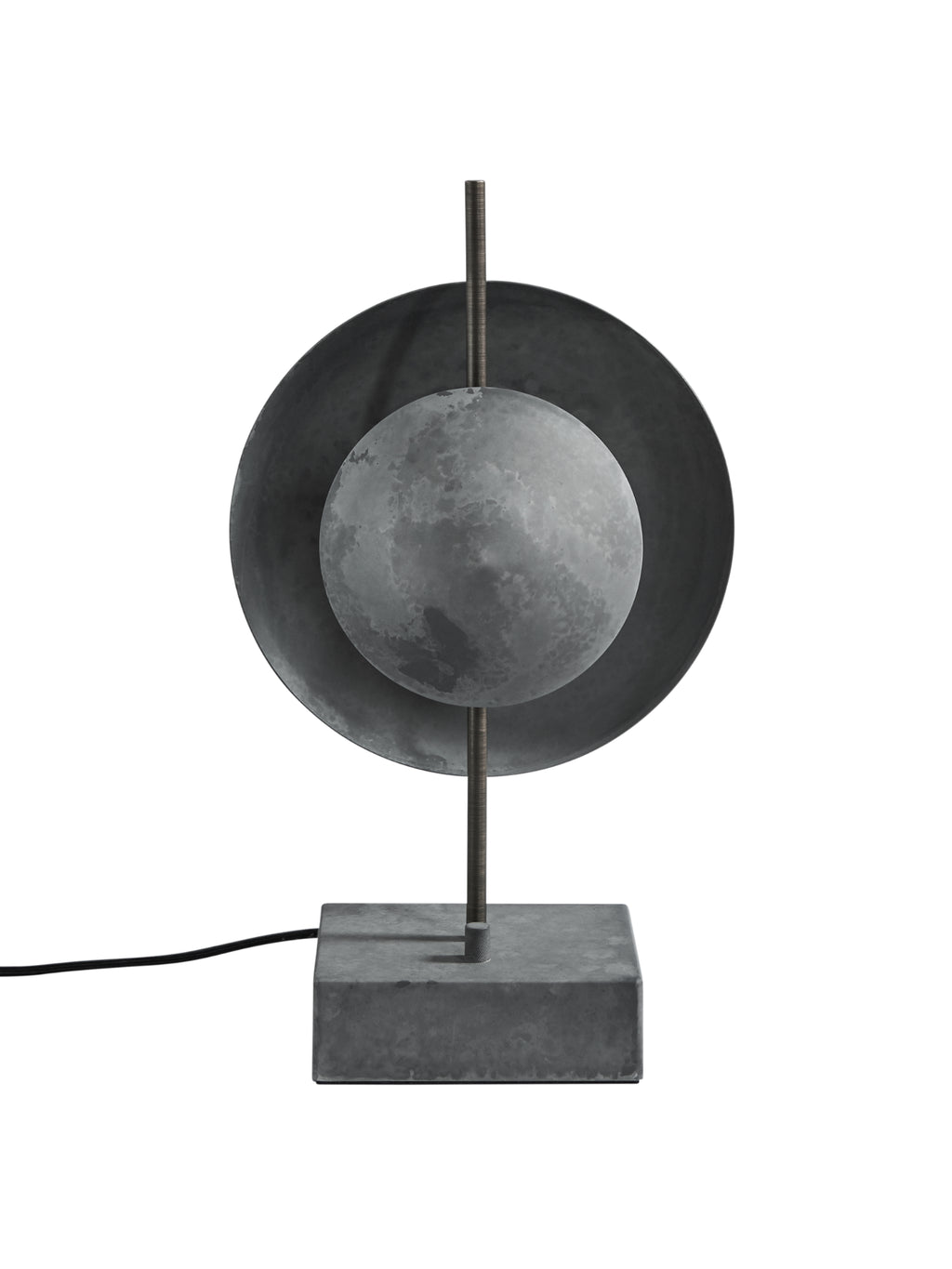 101 CPH Dusk Table Lamp features a dark gray concrete base, a textured gray spherical light, and a darker gray disc mounted on a rustic bronze rod. This luxury statement piece is perfect for modern interior design.