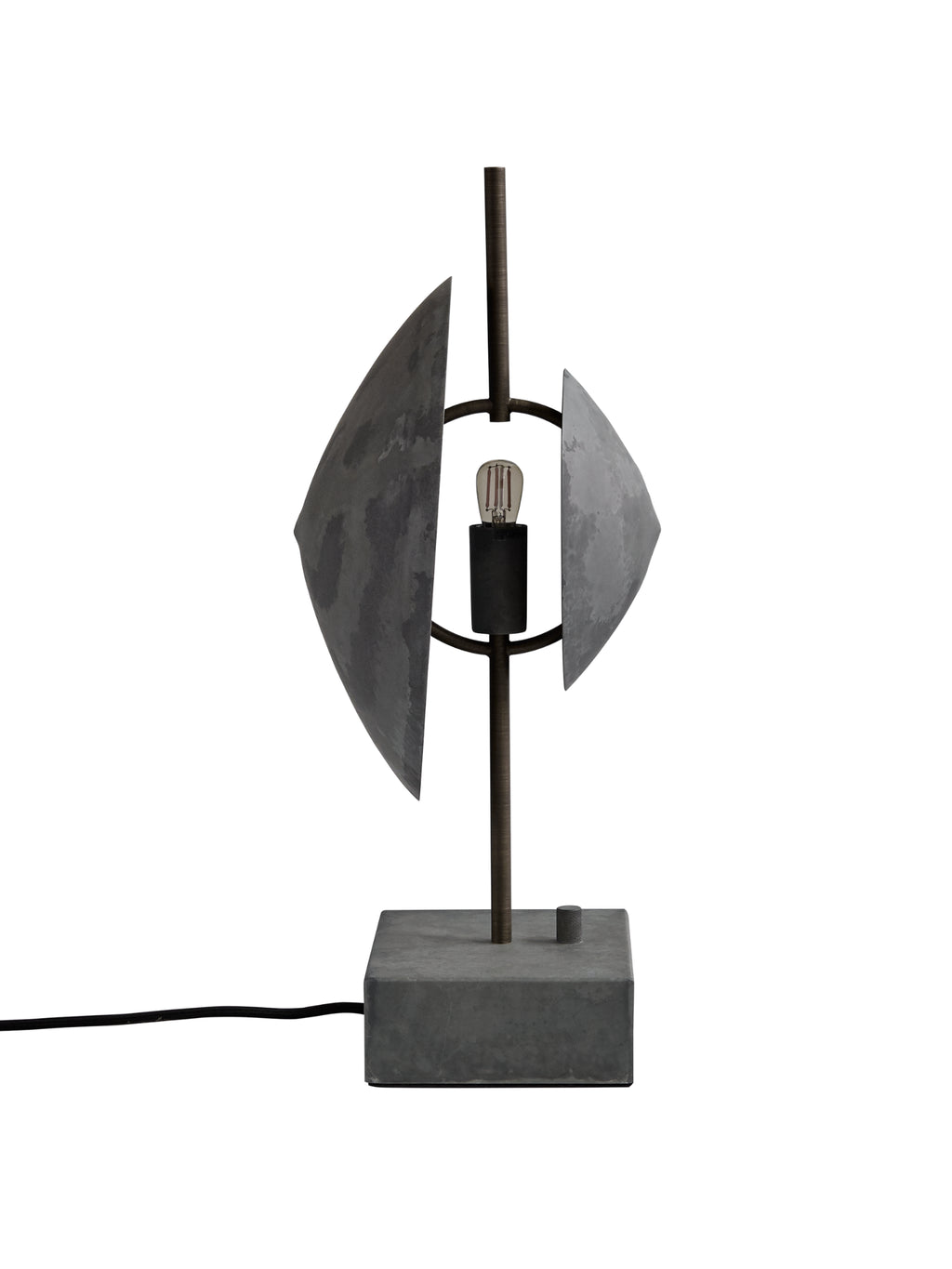 101 CPH Dusk Table Lamp features a dark gray raw concrete base & steel frame, with two semi-circular distressed dark gray metal shades framing an Edison bulb. A unique luxury table lamp for modern interior decor.