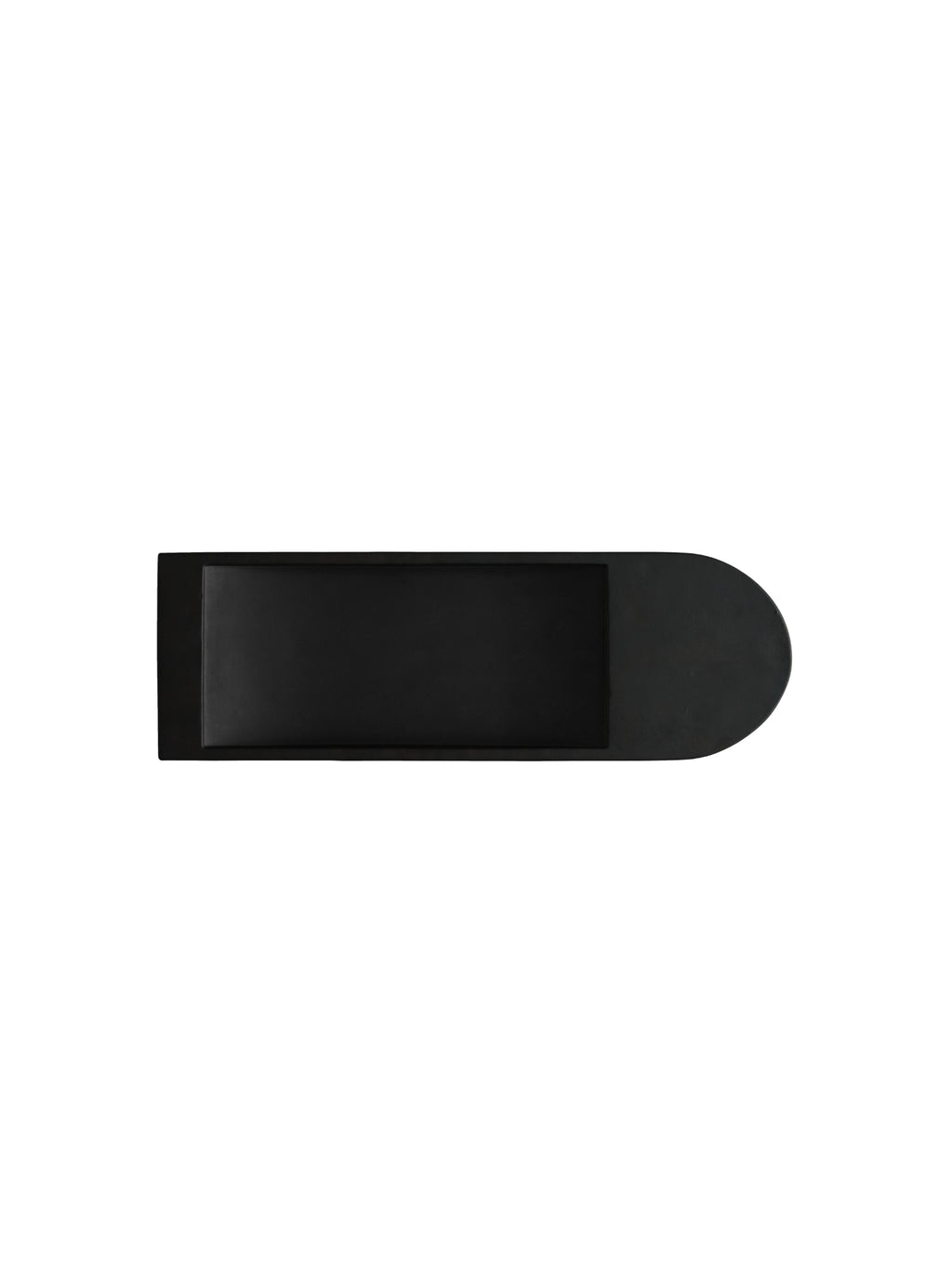 101 CPH Geta Tray, a minimalist rectangular solid black decorative tray with a deep recessed interior and one rounded end, captured from a top-down view. Ideal for chic home organization.
