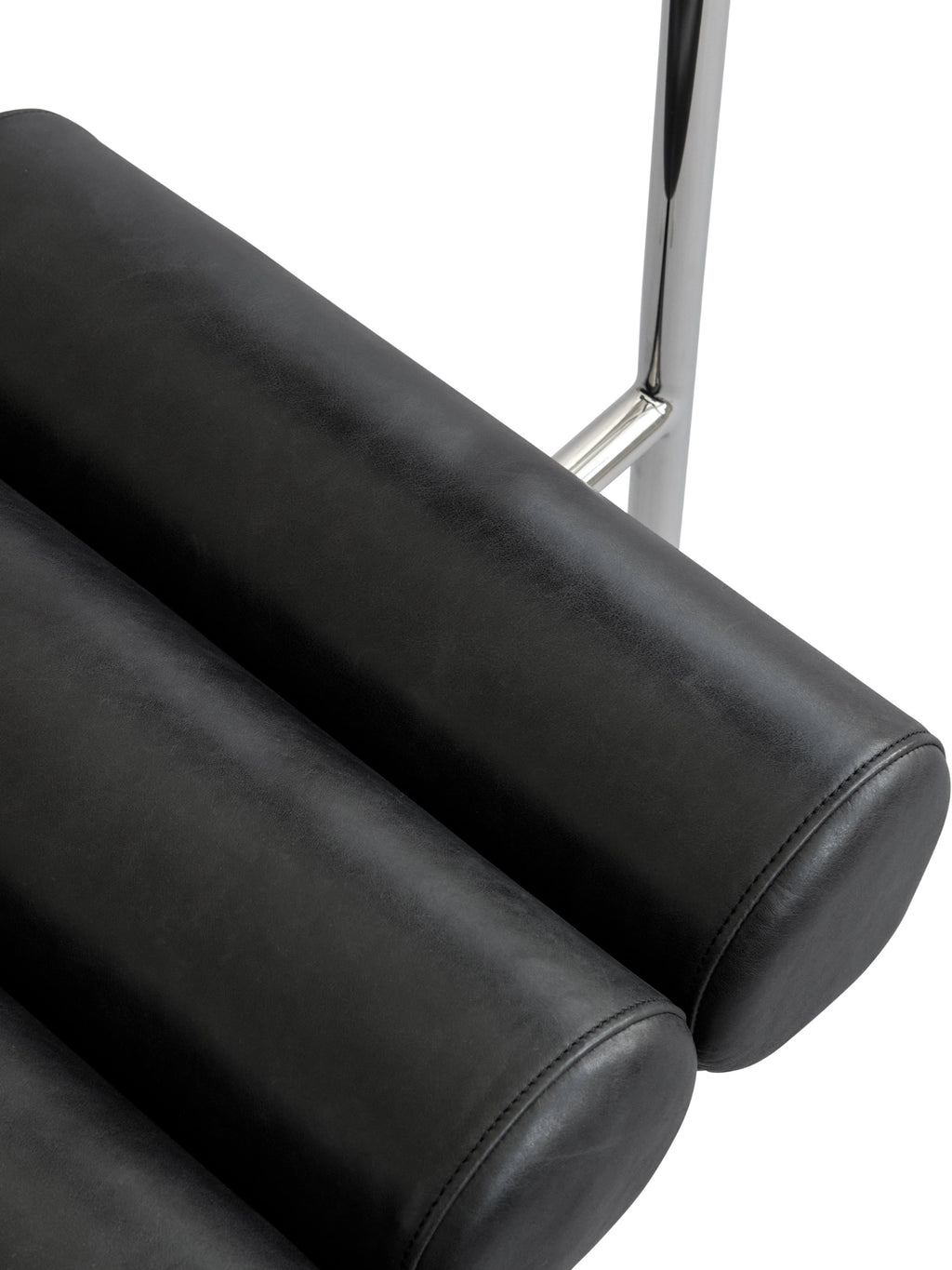 101 CPH Hiro Dining Chair, a close-up angled shot revealing the deeply padded, individual black faux leather cylindrical cushions with visible stitching, attached to sleek chrome metal support bars. A modern luxury seating solution for any dining space.