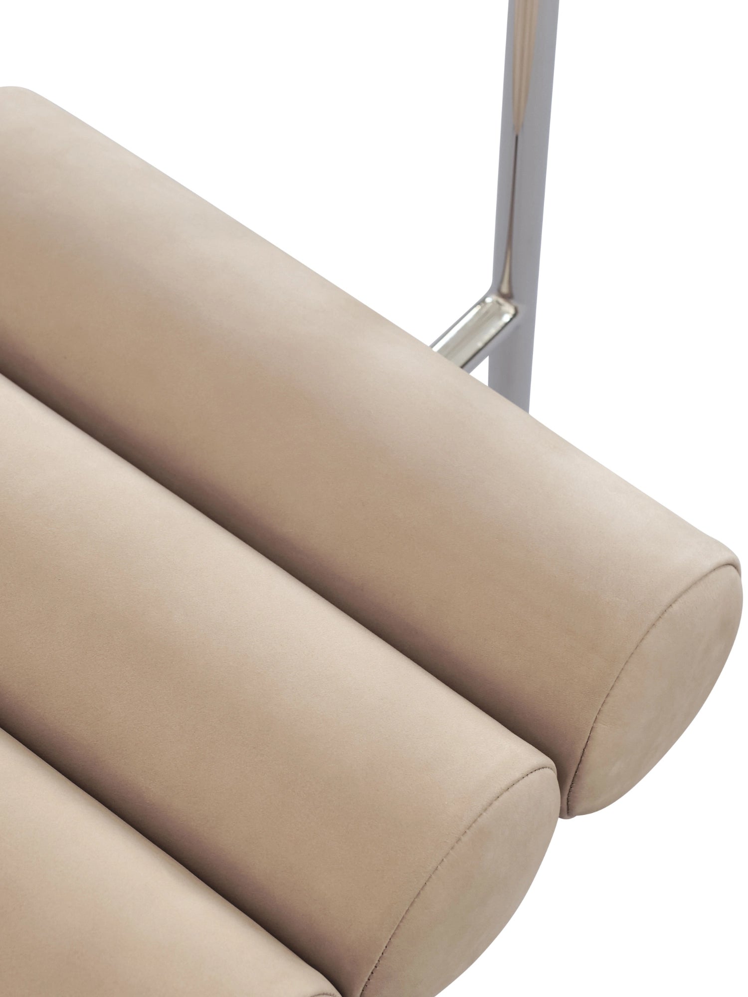 101 CPH Hiro Dining Chair, close-up of three beige upholstered horizontal tubular cushions with visible stitching, and a shiny silver metal bar behind. A premium, comfortable seating option.