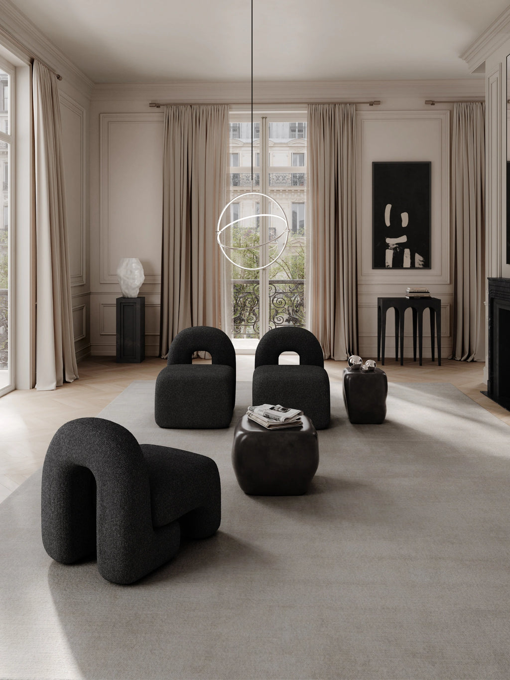 101 CPH Ishi Coffee Table Set - Ceramic, two contemporary dark gray ceramic tables with organic, irregular shapes, one topped with a newspaper and the other with silver spheres, displayed as part of a luxurious living room arrangement. Ideal for modern living spaces.