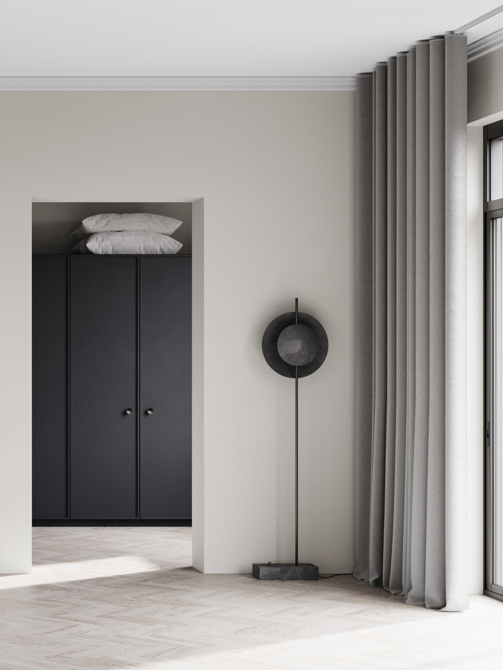 101 CPH Dawn Floor Lamp, featuring a unique black circular shade with a smaller inner disc, set on a slender dark bronze stem and a rectangular marble base, in a modern living space. This premium designer lamp creates ambient lighting.