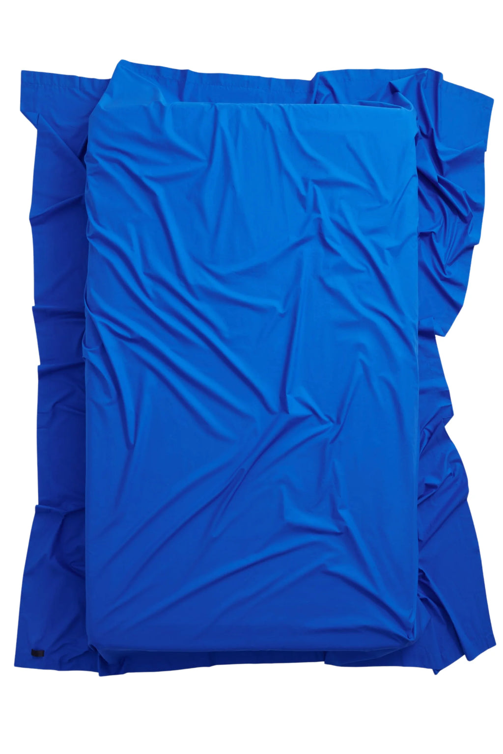 Magniberg Mother Poplin Flat Sheet, a vibrant royal blue flat sheet crafted from crisp cotton poplin, featuring a smooth finish with natural, soft wrinkles for a relaxed yet refined look. This minimalist electric blue bedding offers a bold pop of color, perfect for contemporary bedroom decor or a modern guest room seeking vibrant bed linens.