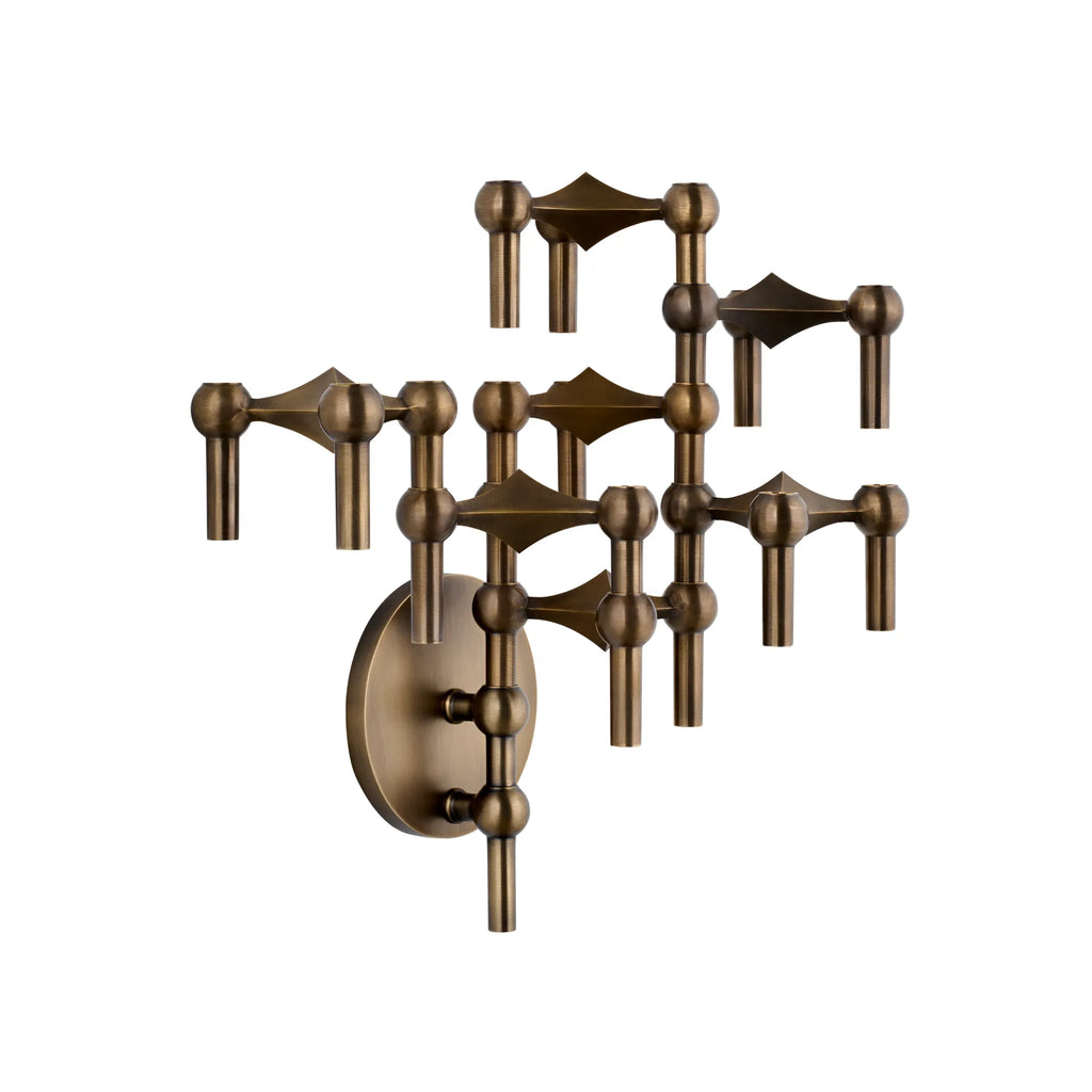 Stoff Nagel Wall Hanger Candle Holder - Bronzed Brass - Configuration 3, a striking mid-century modern modular candle holder crafted from rich bronzed brass with a brushed, aged finish. Its sculptural design features interlocking rounded and pointed elements, creating a dynamic brutalist-inspired wall art piece. Perfect for contemporary gallery walls, living room accents, or industrial chic interiors.