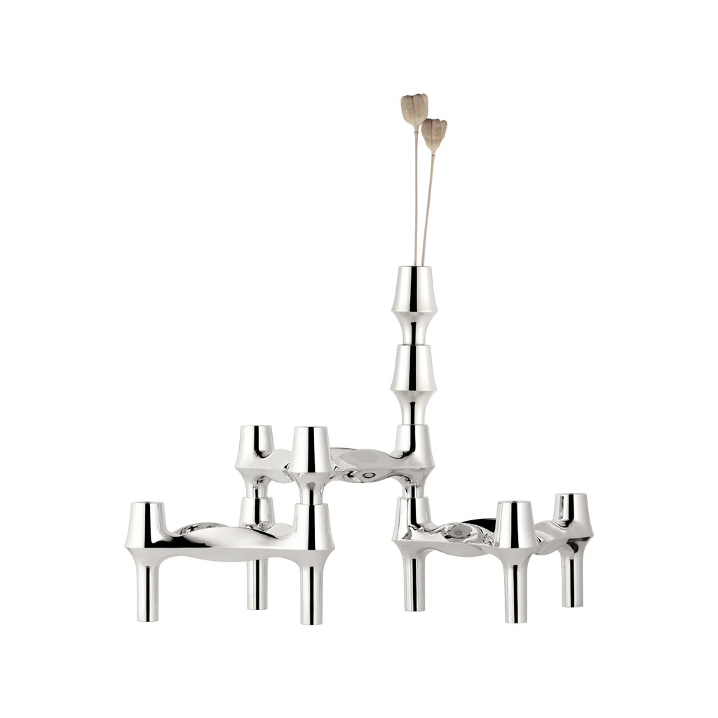 Stoff Nagel BMF Candle Holder - Configuration 1, a modular polished chrome candle holder with a distinctive sculptural, mid-century modern design featuring interlocking, stackable elements. This iconic chrome piece functions as both a candle holder and a decorative vase for dried botanicals, showcasing a brilliant, reflective finish. Perfect as a contemporary dining table centerpiece or a brutalist-inspired accent for living room shelf styling.