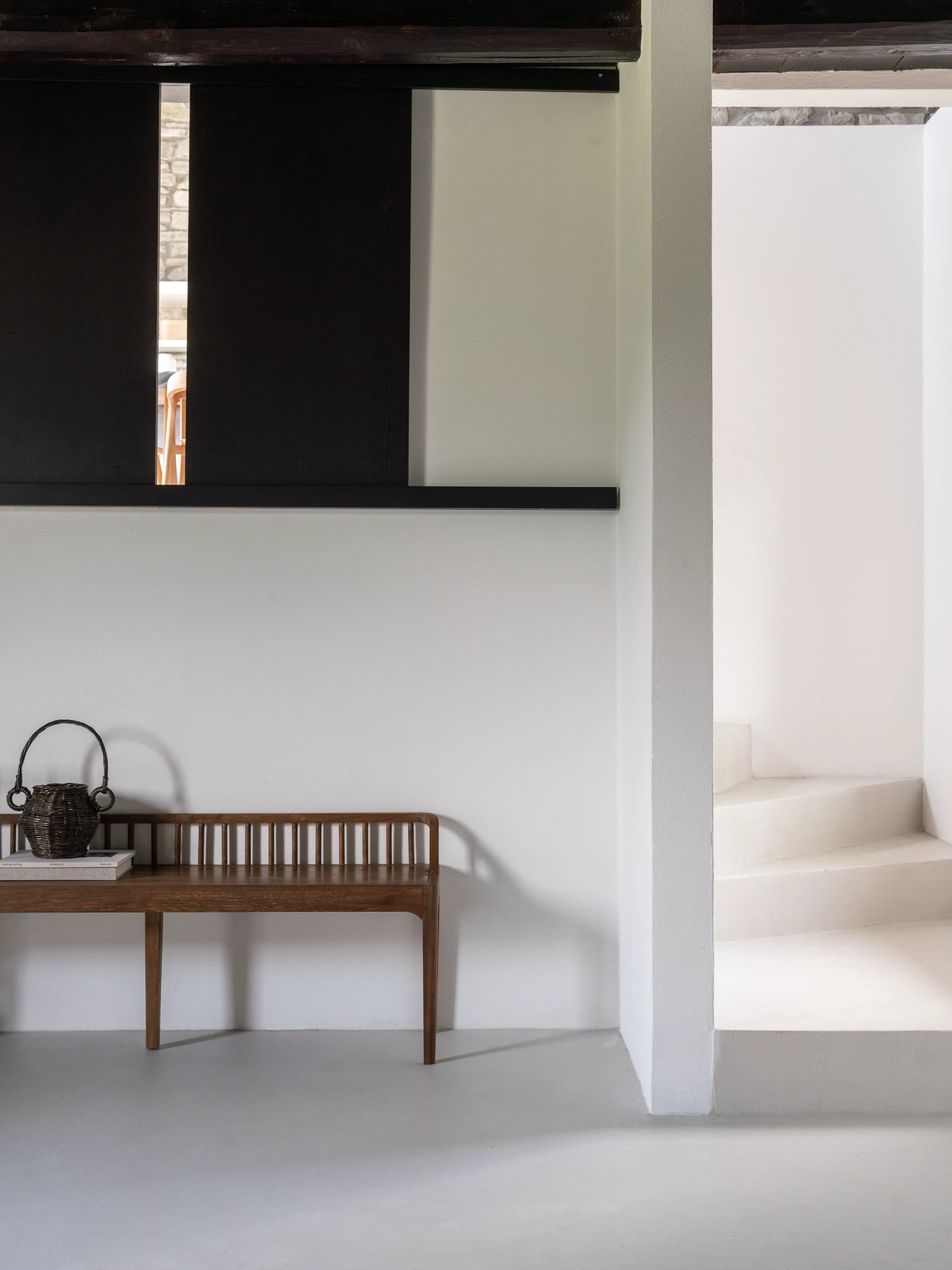 Ethnicraft Spindle Bench, a mid-century modern solid teak wood bench with a warm natural finish and an elegant spindle backrest.