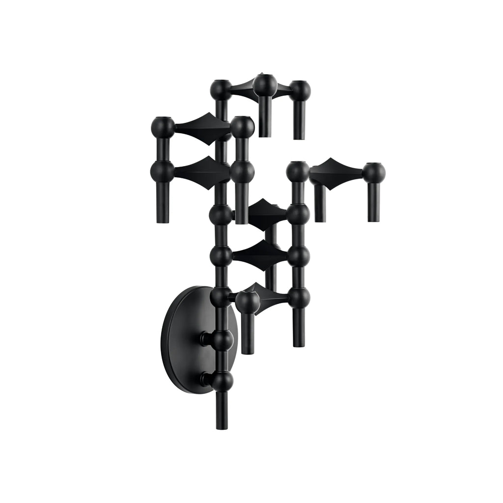 Stoff Nagel Wall Hanger Candle Holder - Black - Configuration 3, a striking matte black metal modular candelabra featuring interlocking spherical and conical elements that form a sculptural, abstract wall art piece. This mid-century modern design offers a brutalist aesthetic, perfect as a contemporary wall-mounted candle holder or decorative statement for living rooms, entryways, or minimalist interiors.