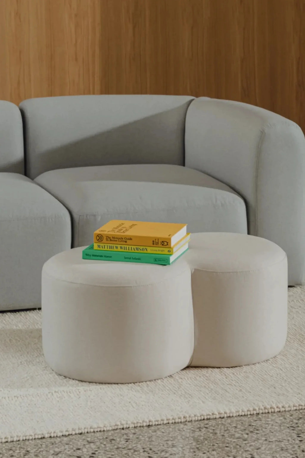 noo.ma Flom 2-Seater Sofa, a light grey modular sofa upholstered in a soft textured fabric with a gently curved, organic profile and plush deep seating. This contemporary low-profile sofa offers a modern minimalist aesthetic, perfect for spacious living rooms or Scandinavian-inspired interiors.