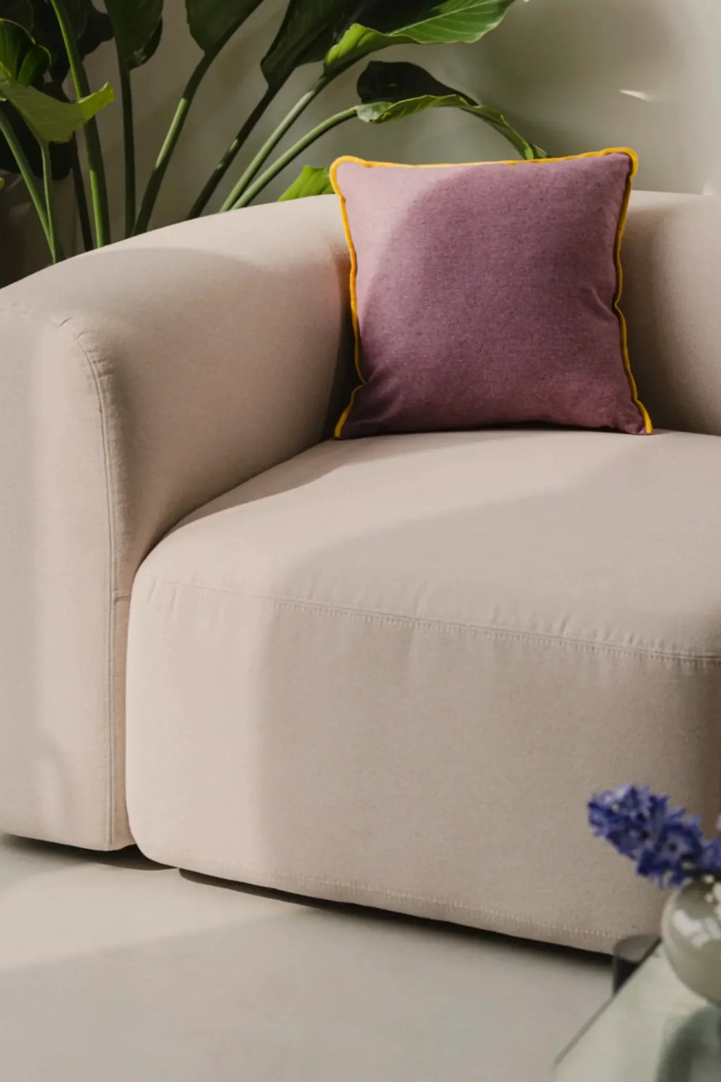 noo.ma Flom 2-Seater Sofa, a light beige upholstered sofa featuring a soft, rounded, and organic modern design with generous deep seating and a sleek, minimalist profile.