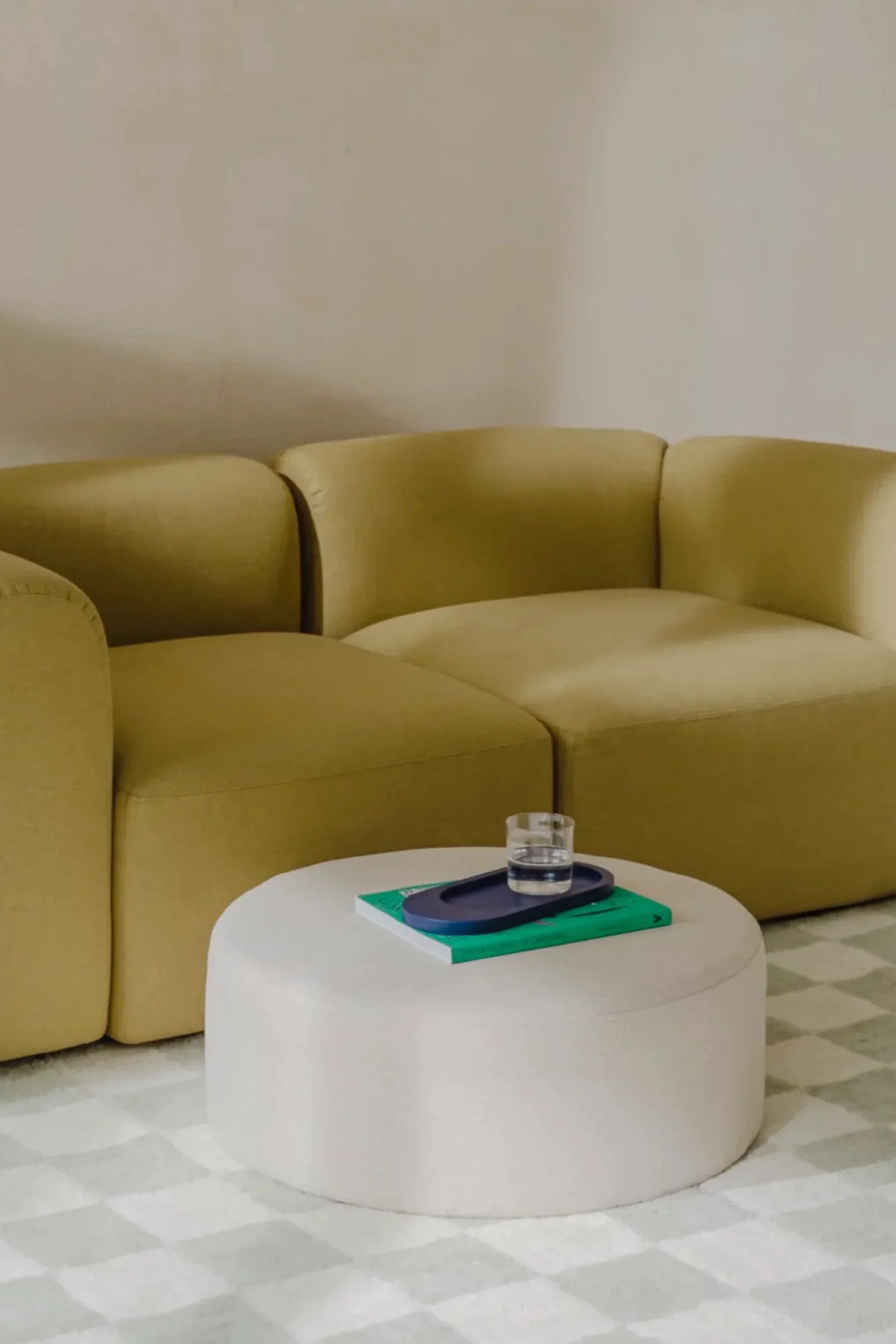 noo.ma Flom 2-Seater Sofa, a contemporary modular sofa featuring a vibrant chartreuse yellow soft-touch fabric upholstery and an organic rounded silhouette with plush, armless seating. Its minimalist design and inviting curves make it an ideal statement piece for modern living rooms or stylish apartment lounges.